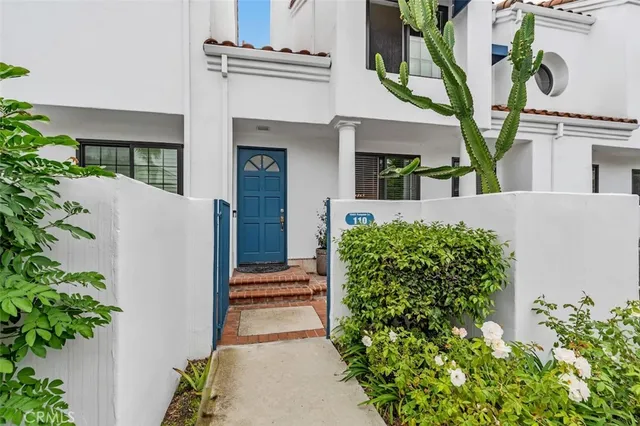 front view of a house with a potted plant