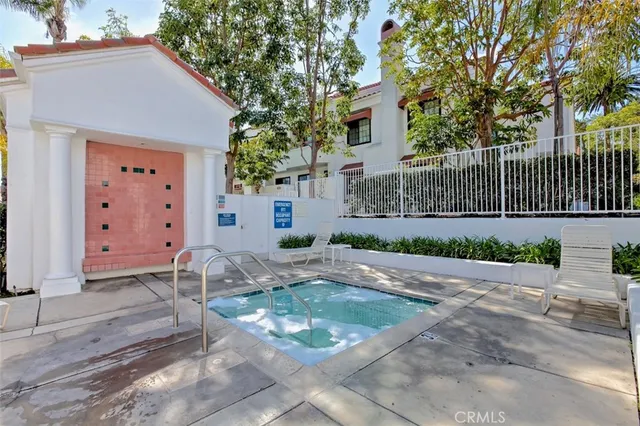a view of a swimming pool with palm trees