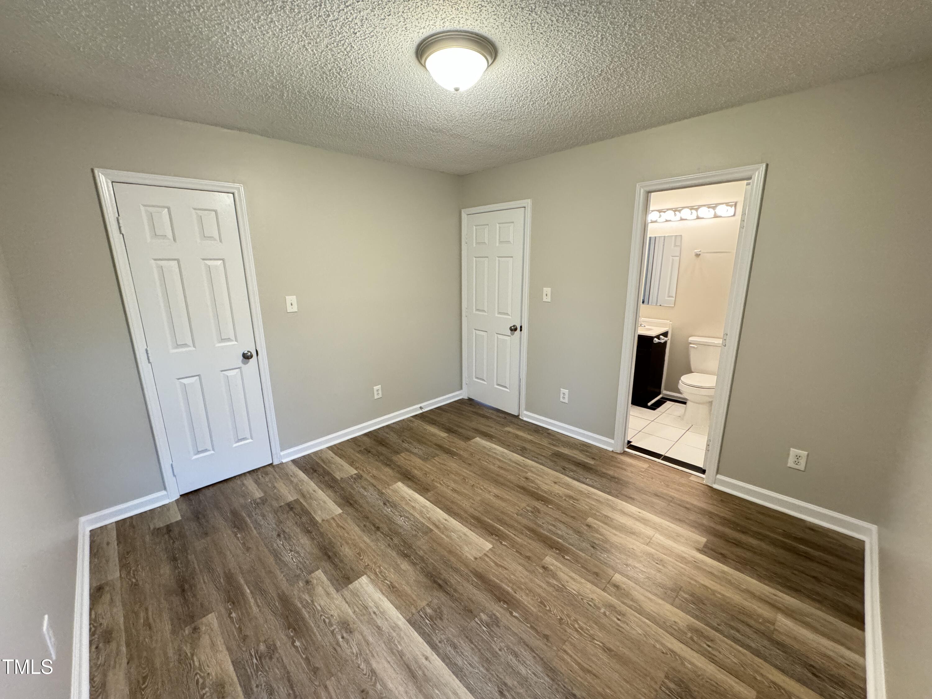 456 Dickens Drive Raleigh, NC 27610 - Photo 21 of 33 a view of empty room with wooden floor