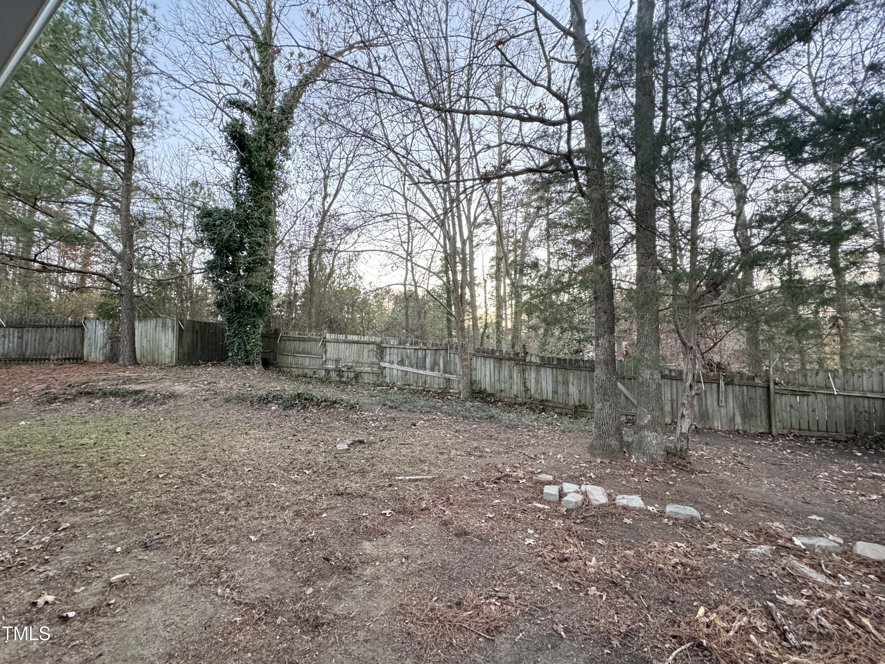 456 Dickens Drive Raleigh, NC 27610 - Photo 27 of 33 a view of a backyard with large trees