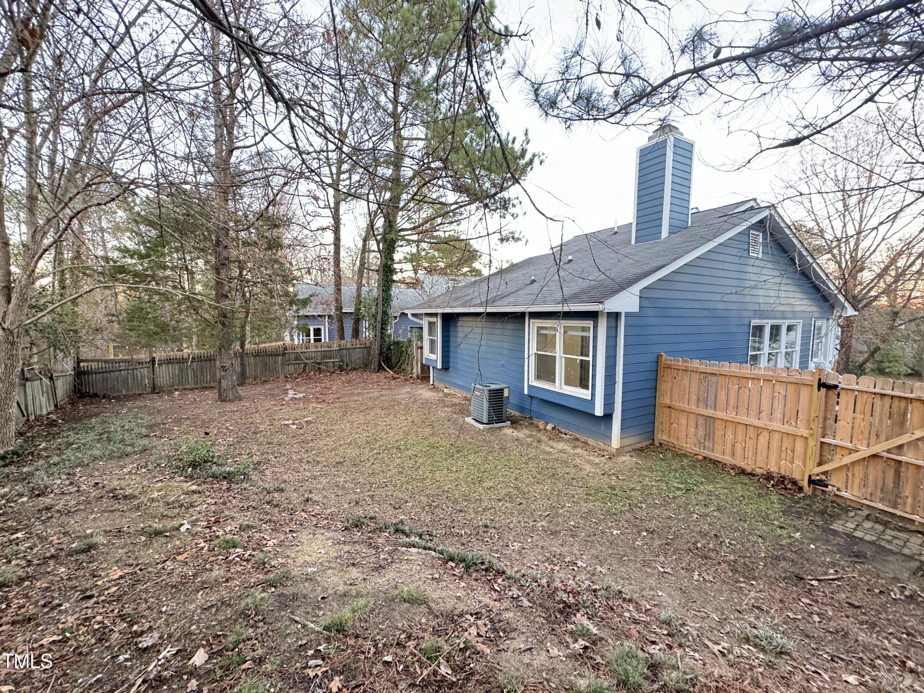 456 Dickens Drive Raleigh, NC 27610 - Photo 28 of 33 a view of a house with a yard and large tree