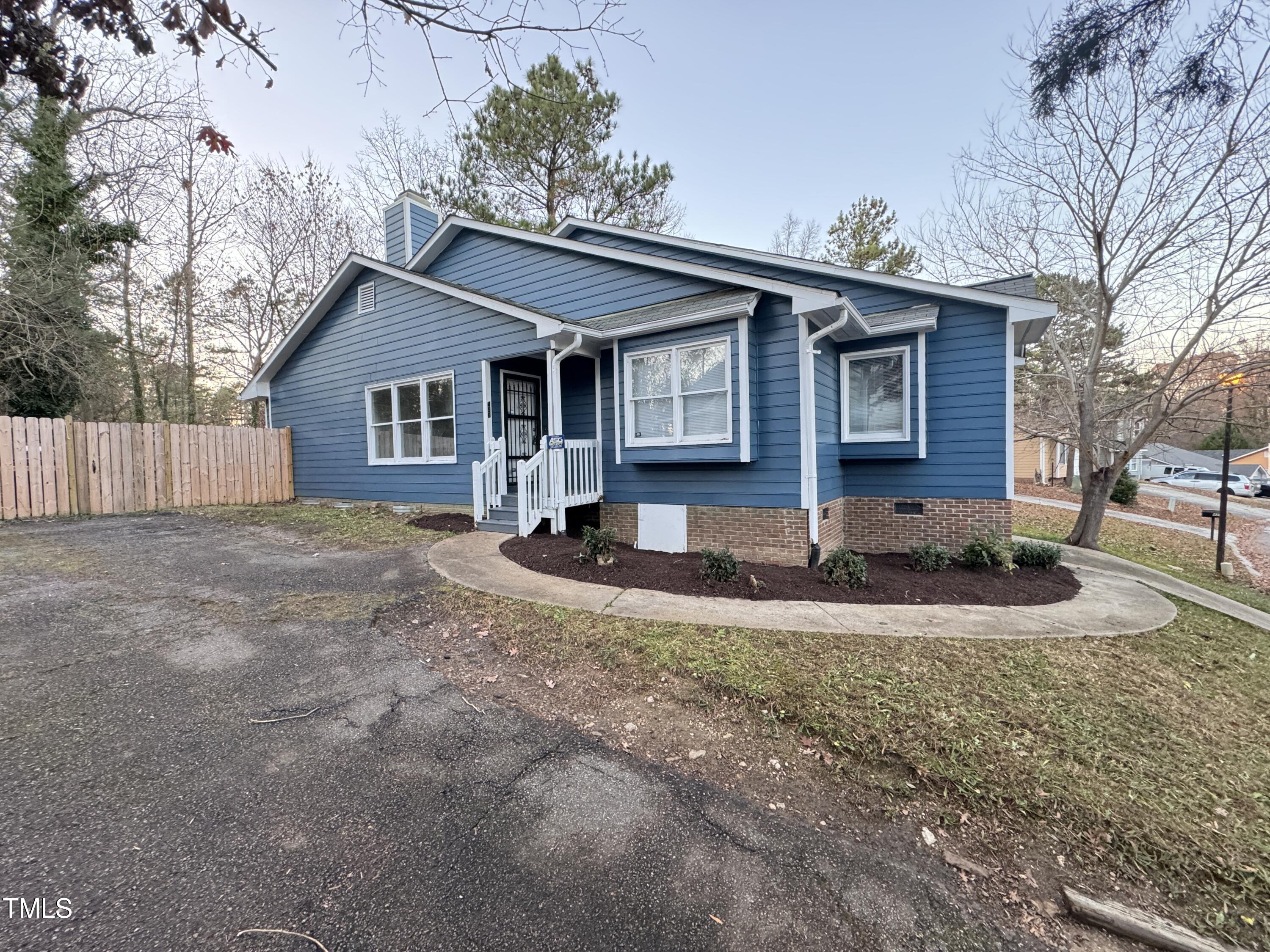456 Dickens Drive Raleigh, NC 27610 - Photo 29 of 33 a front view of house with yard and trees around