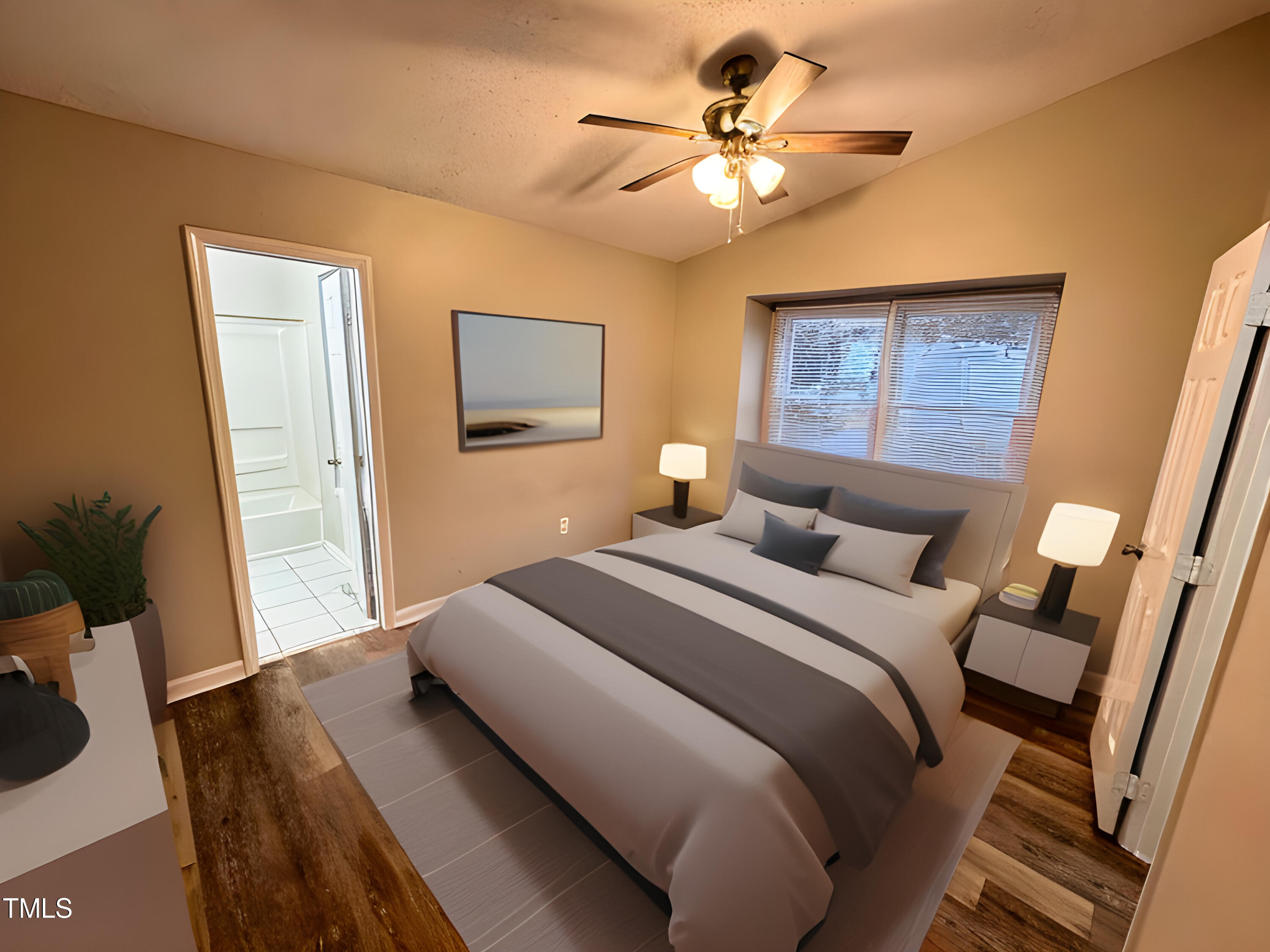 456 Dickens Drive Raleigh, NC 27610 - Photo 4 of 33 a bedroom with a large bed with wooden floor
