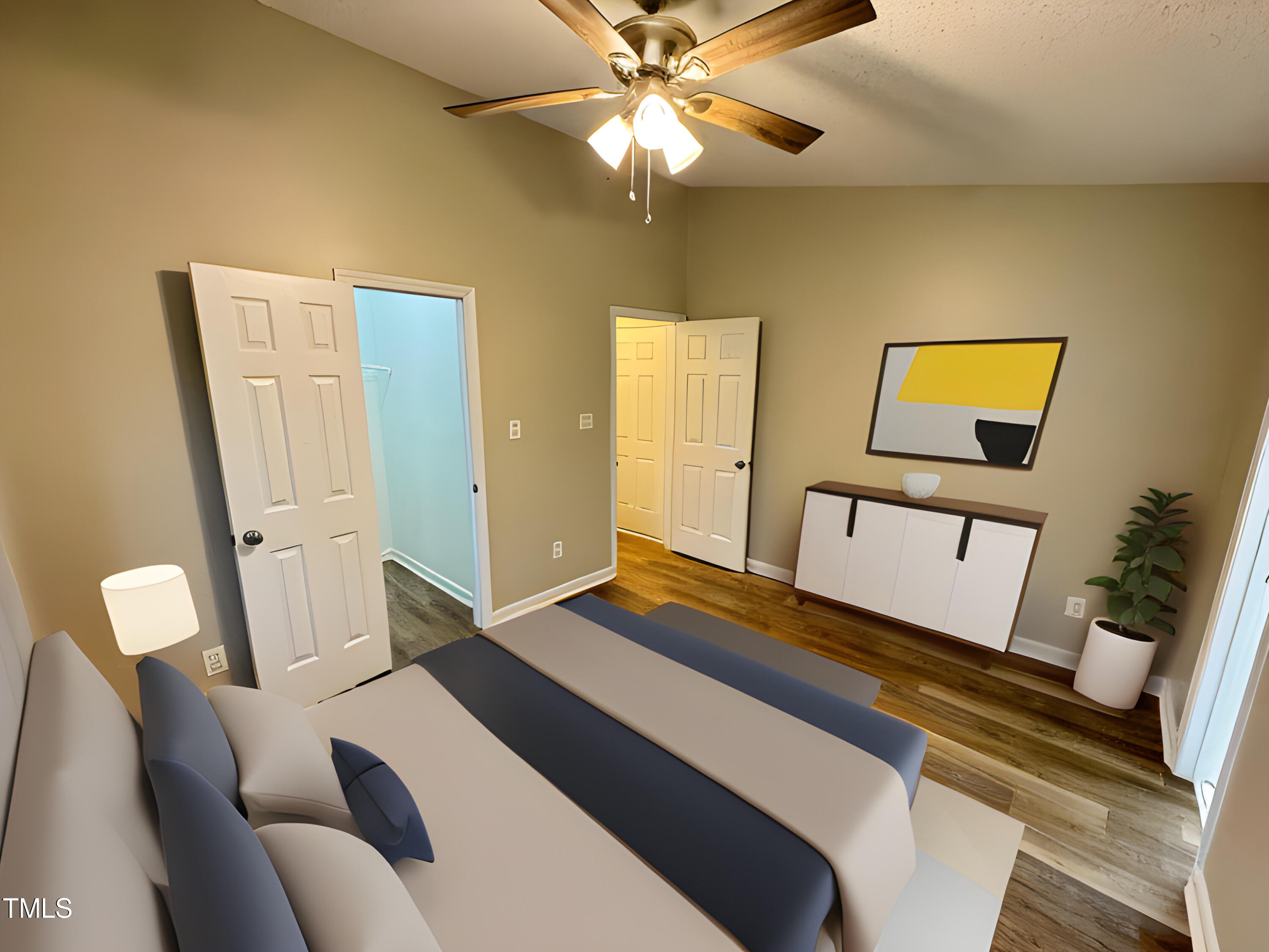 456 Dickens Drive Raleigh, NC 27610 - Photo 5 of 33 a bedroom with a bed and wooden floor