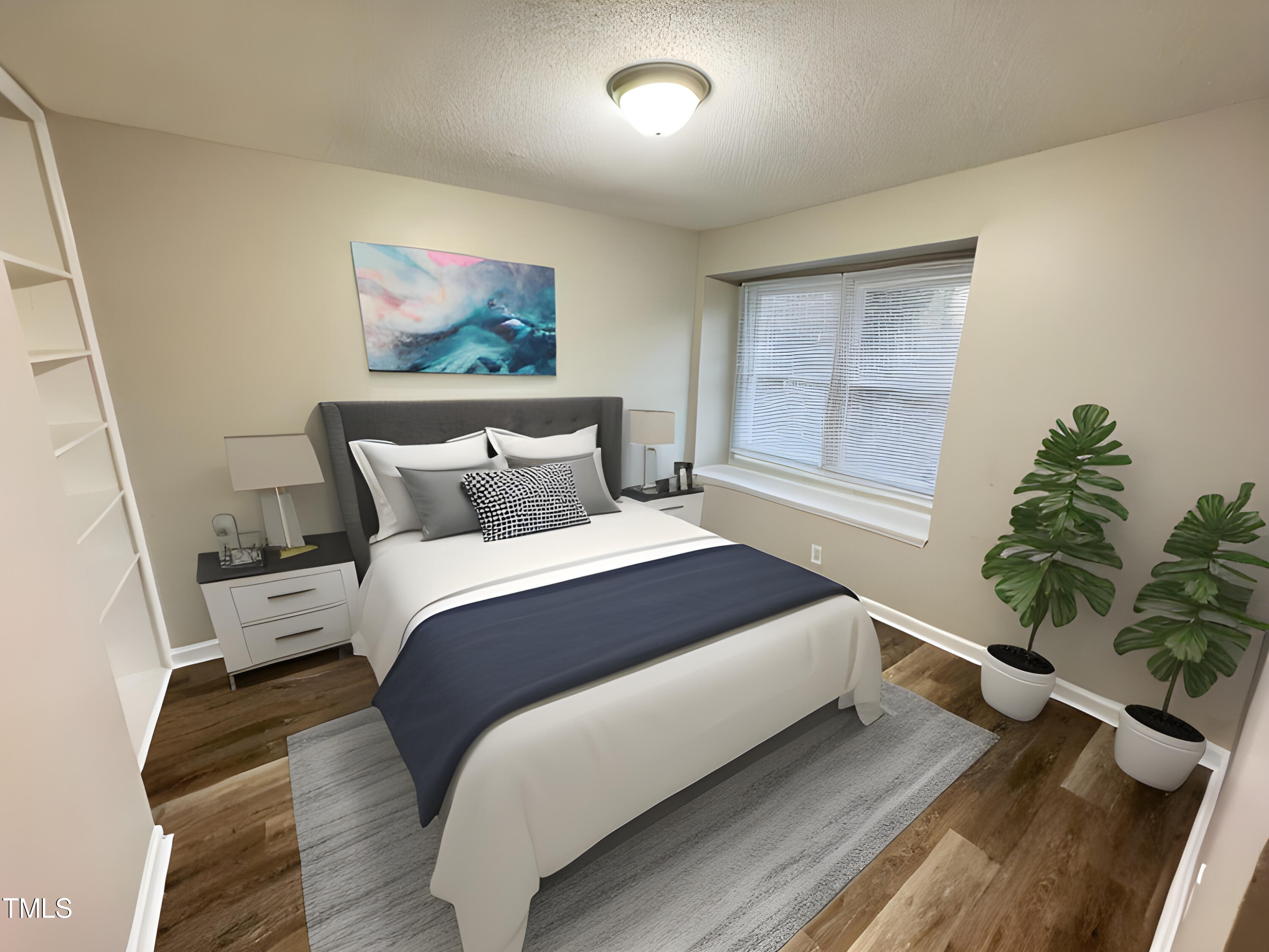 456 Dickens Drive Raleigh, NC 27610 - Photo 6 of 33 a bedroom with a large bed and a painting on the wall