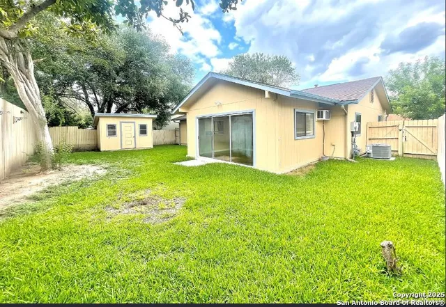 a front view of a house with yard and green space