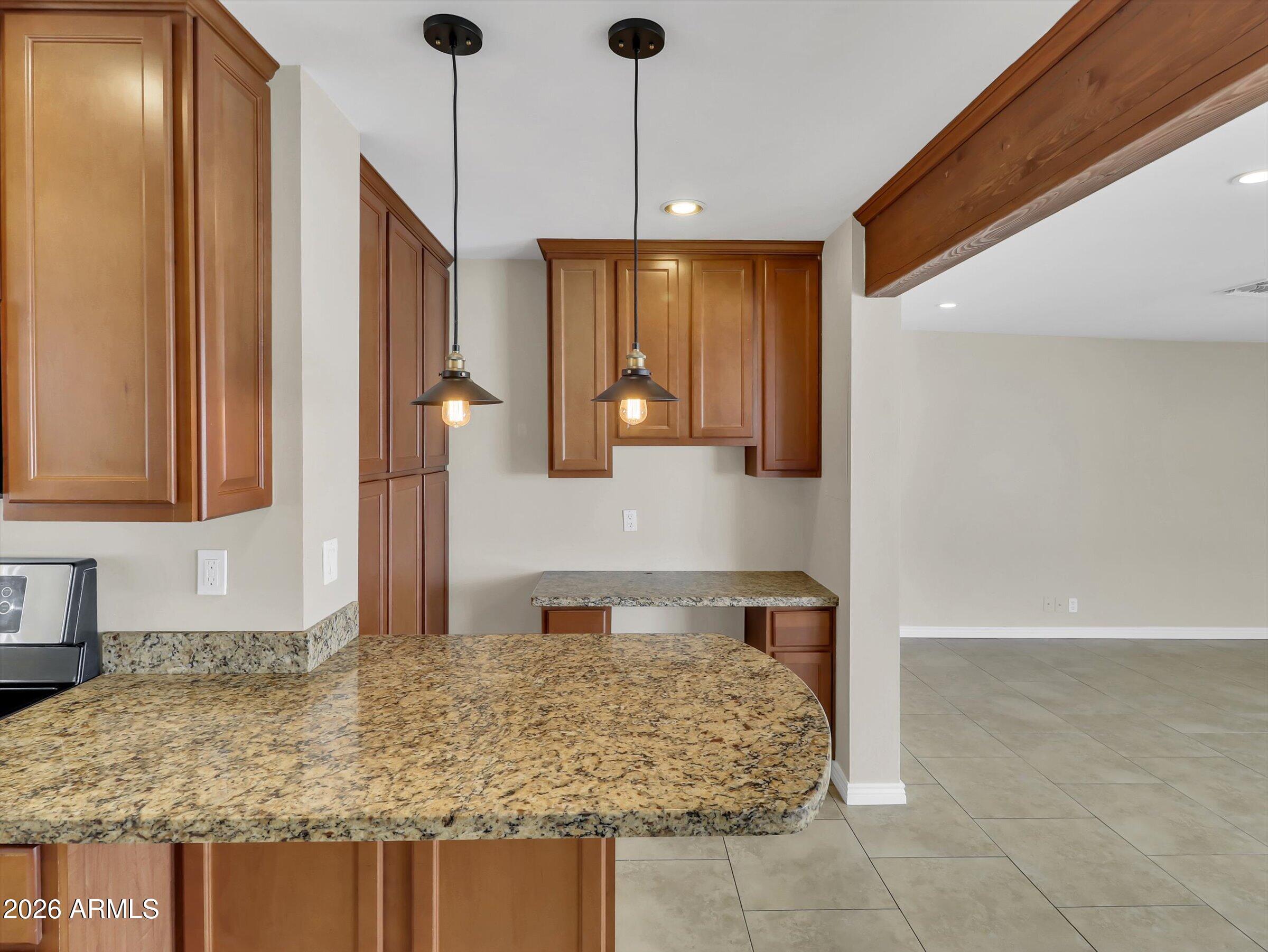 6036 North 8th Street Phoenix, AZ 85014 - Photo 12 of 31 a bathroom with a granite countertop sink and a mirror
