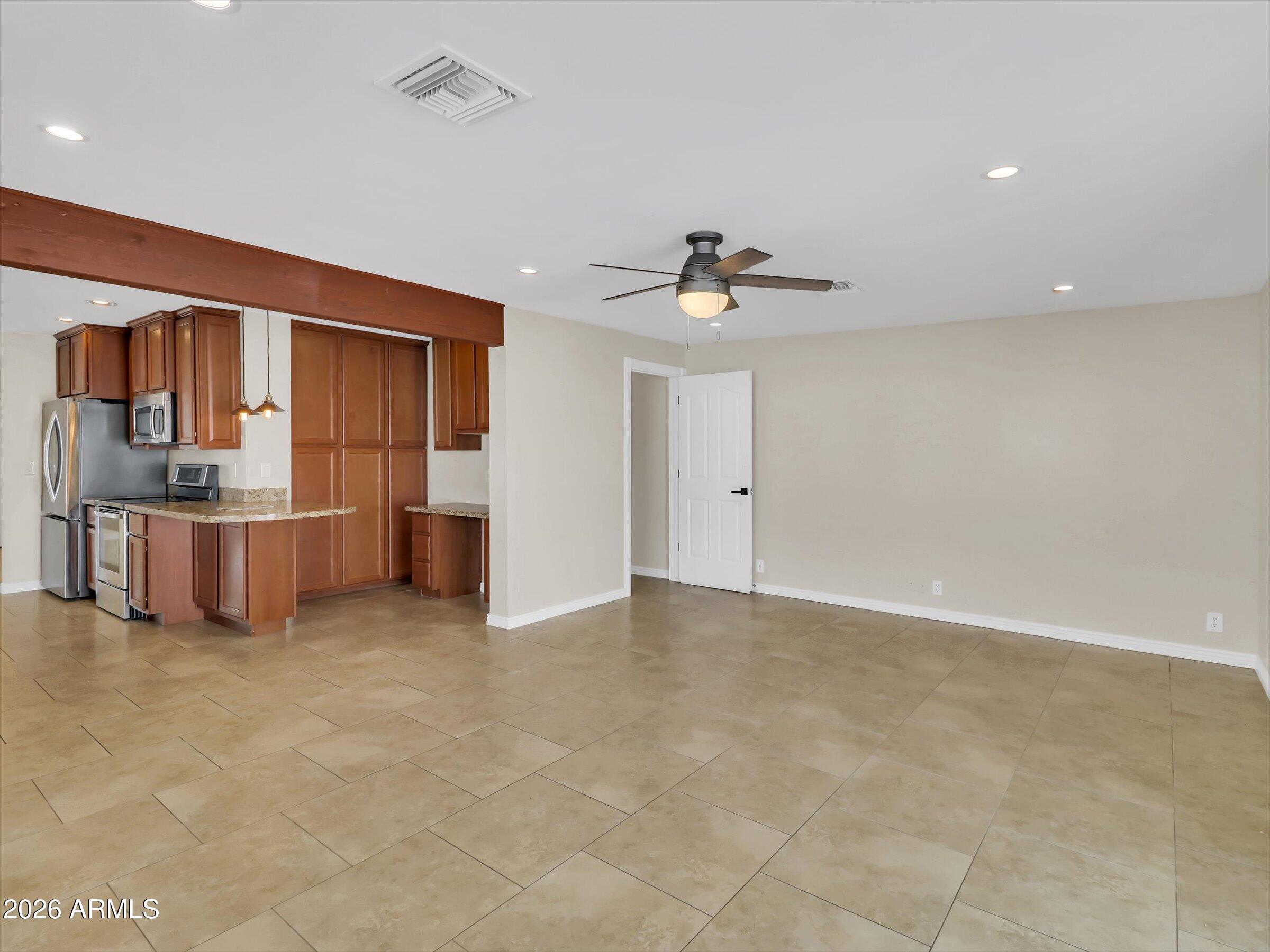 6036 North 8th Street Phoenix, AZ 85014 - Photo 14 of 31 a view of kitchen with refrigerator and cabinets