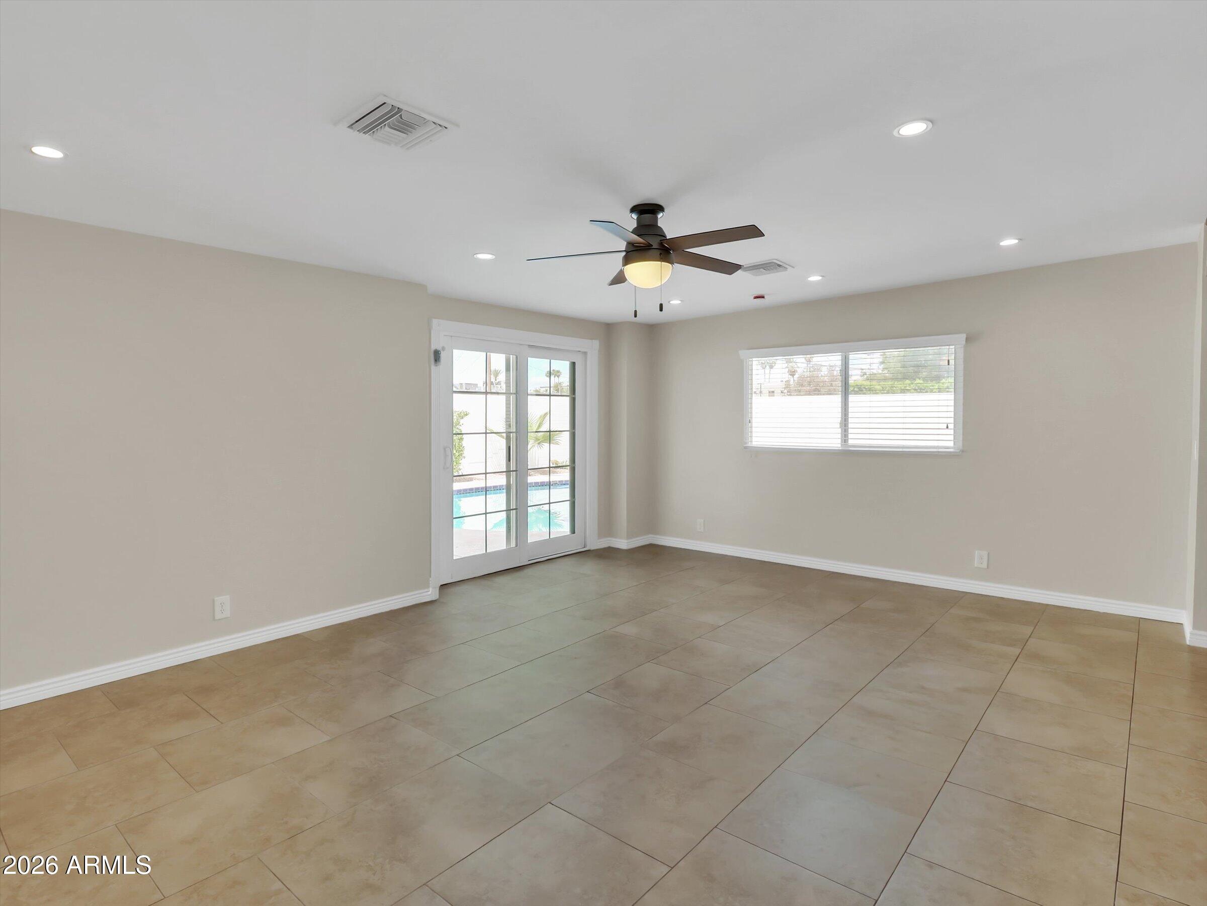 6036 North 8th Street Phoenix, AZ 85014 - Photo 16 of 31 a view of an empty room with a window