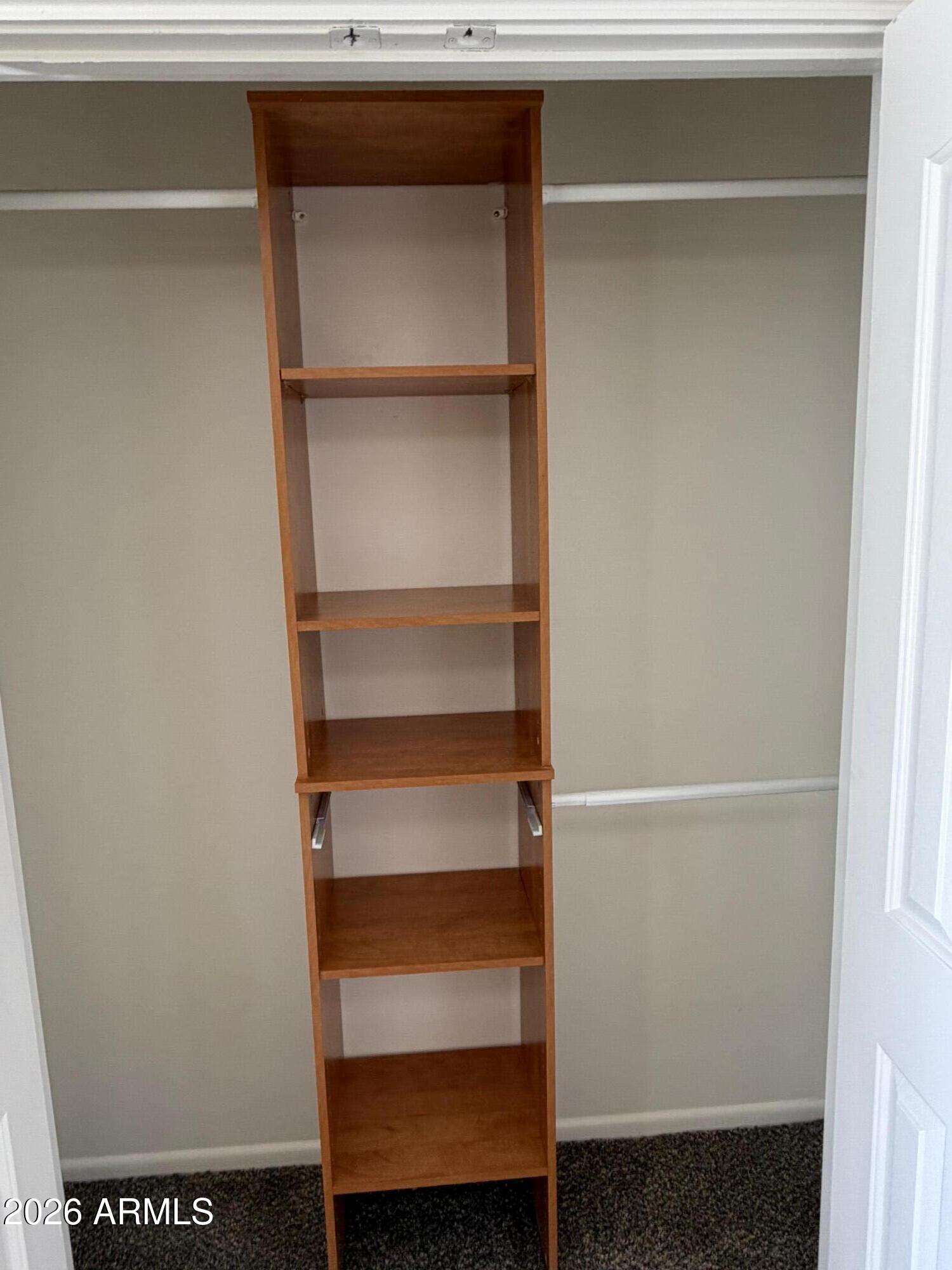 6036 North 8th Street Phoenix, AZ 85014 - Photo 18 of 37 a view of walk in closet with empty racks