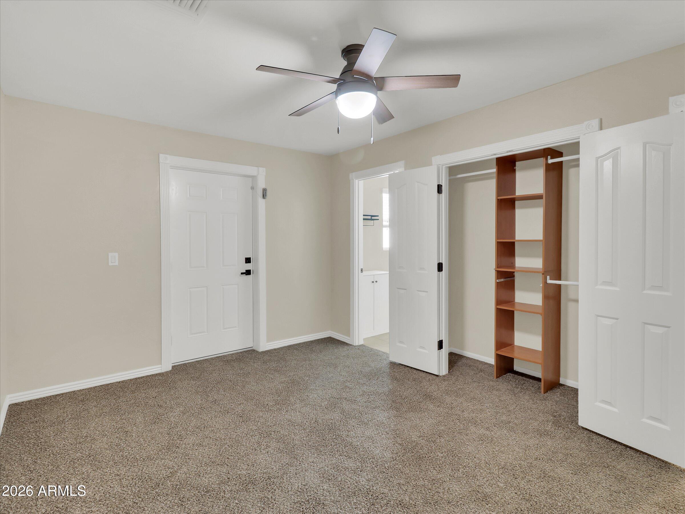 6036 North 8th Street Phoenix, AZ 85014 - Photo 19 of 31 an empty room with closet and windows