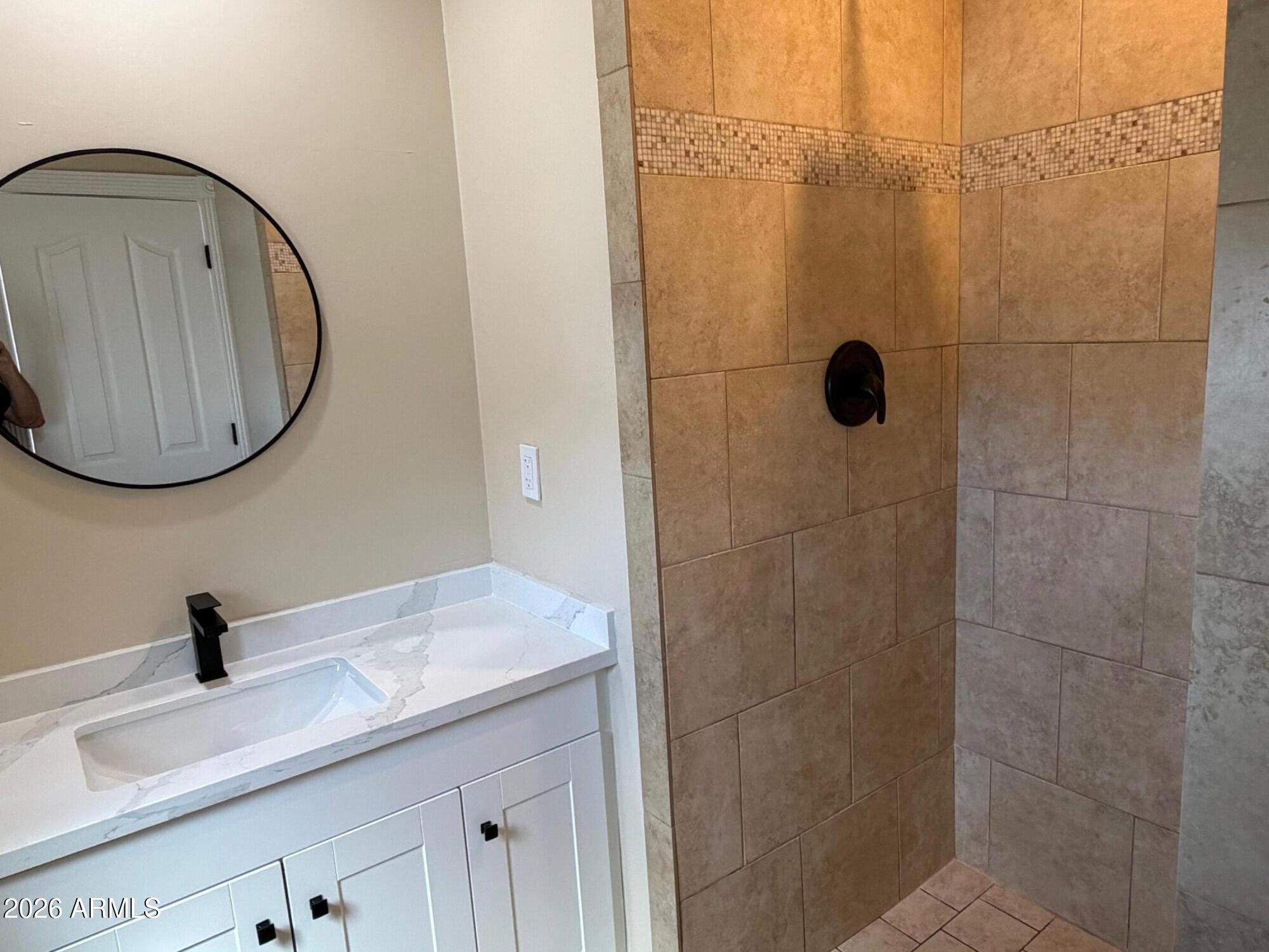 6036 North 8th Street Phoenix, AZ 85014 - Photo 20 of 37 a bathroom with a sink and a mirror
