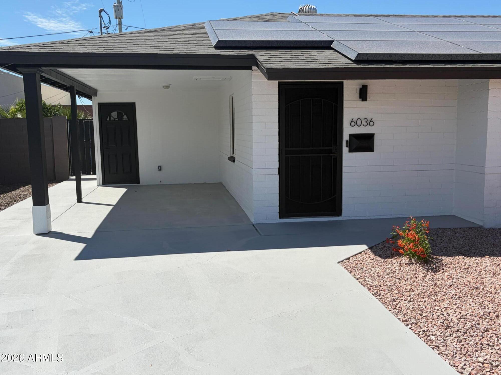6036 North 8th Street Phoenix, AZ 85014 - Photo 2 of 37 a bedroom with a bed and a window
