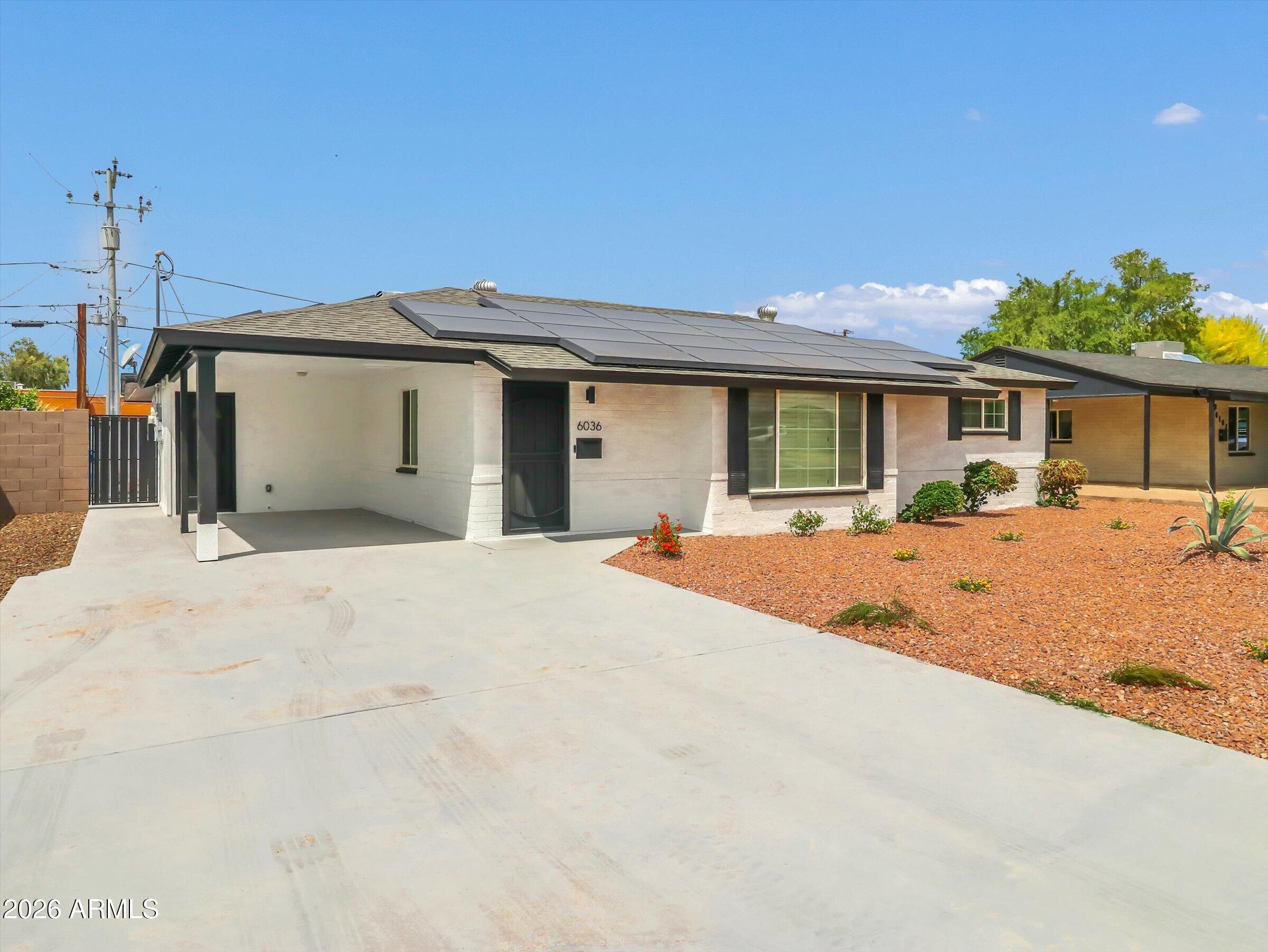 6036 North 8th Street Phoenix, AZ 85014 - Photo 2 of 31 a view of a house with a backyard