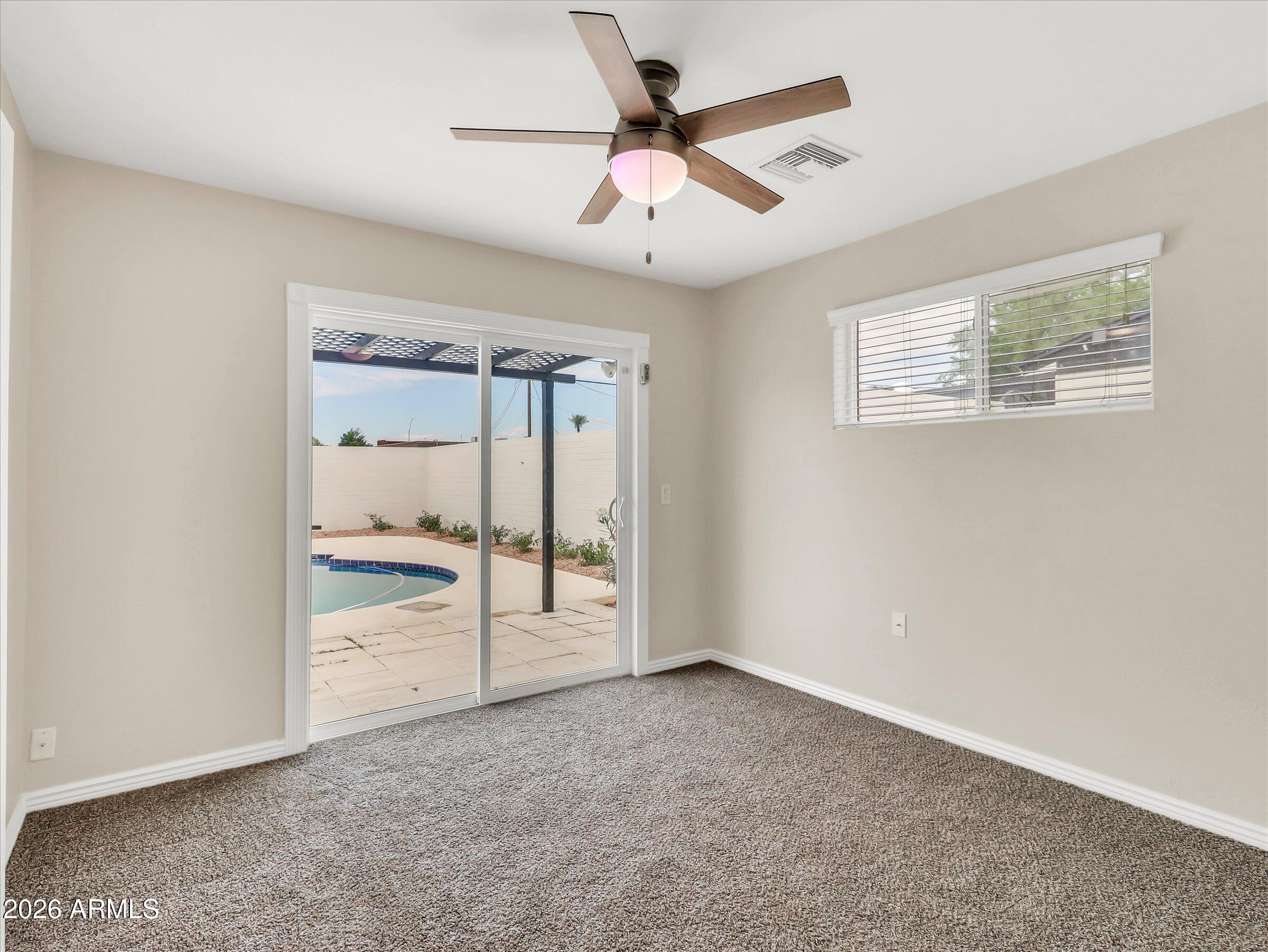 6036 North 8th Street Phoenix, AZ 85014 - Photo 24 of 31 a view of an empty room with a window