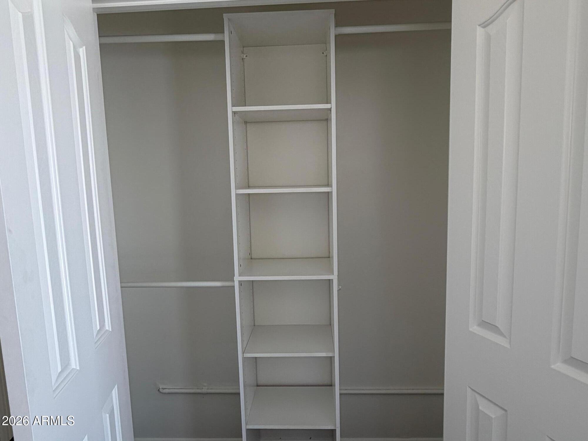 6036 North 8th Street Phoenix, AZ 85014 - Photo 24 of 37 a view of walk in closet with empty racks