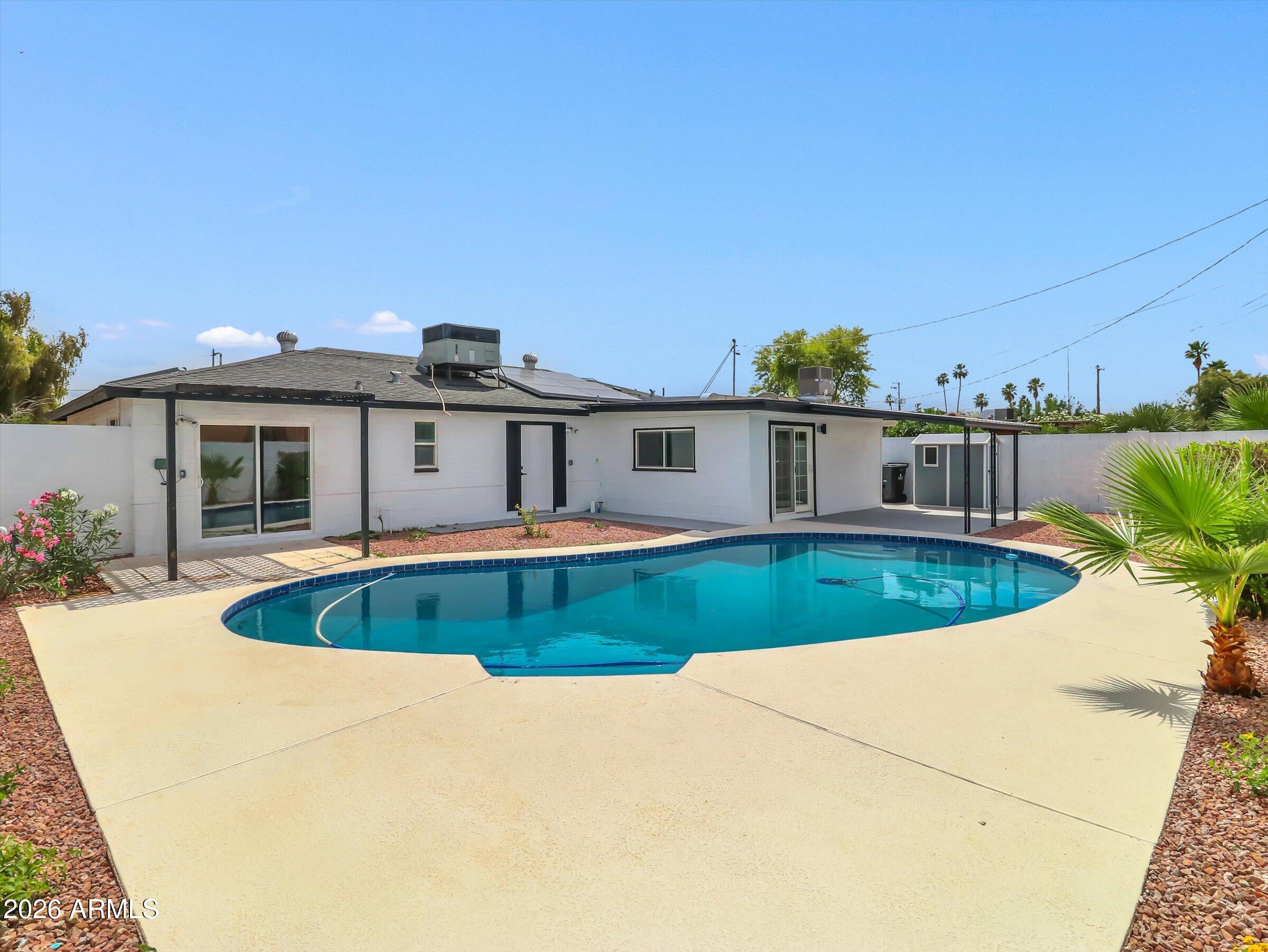 6036 North 8th Street Phoenix, AZ 85014 - Photo 31 of 31 front view of a house with a swimming pool