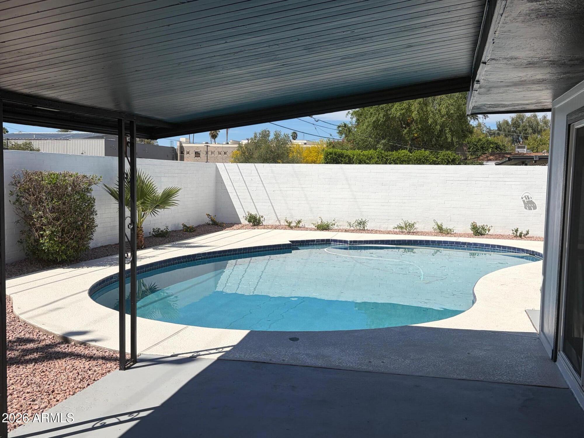 6036 North 8th Street Phoenix, AZ 85014 - Photo 4 of 37 a view of a balcony with floor to ceiling windows with wooden floor