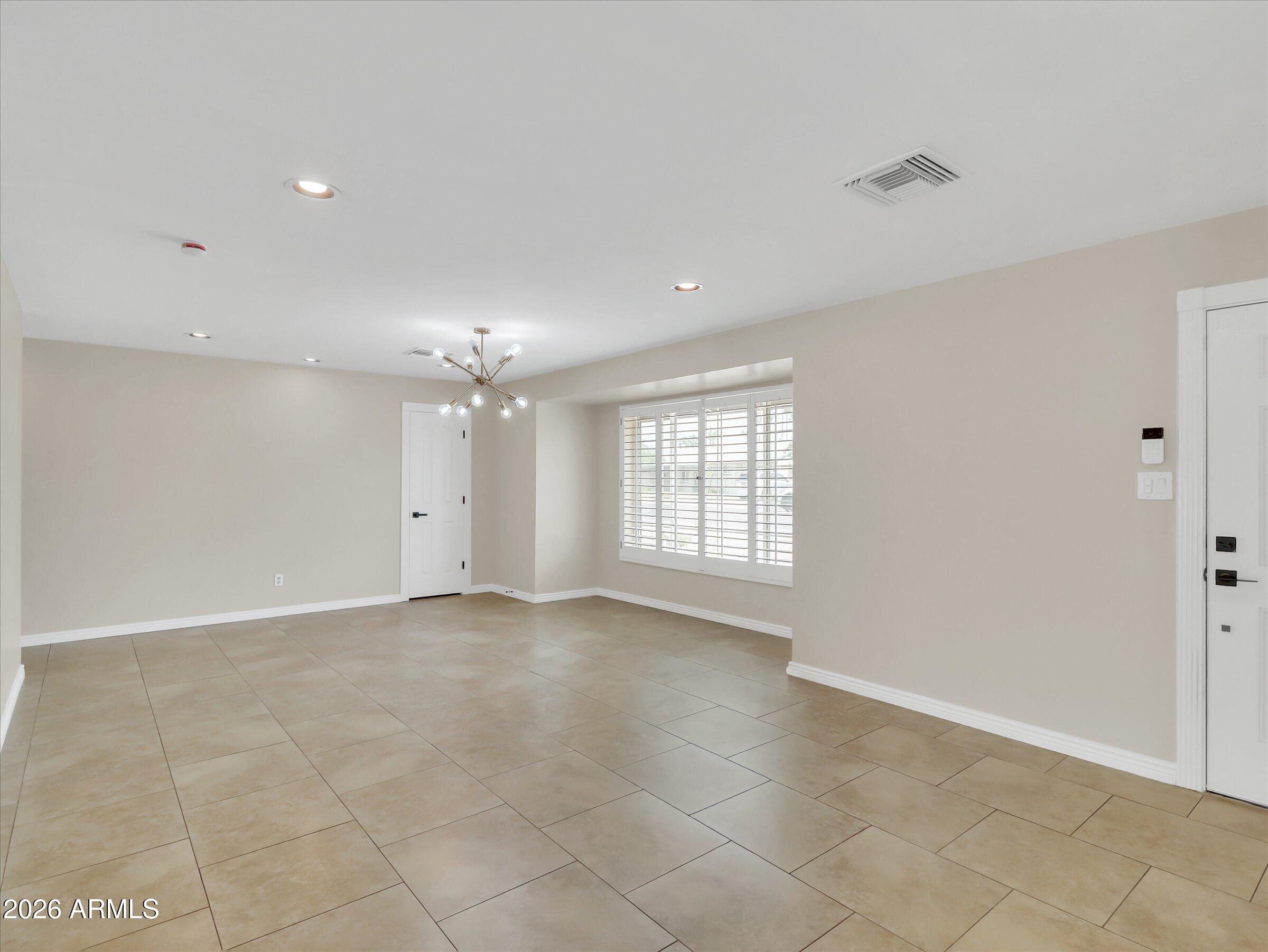 6036 North 8th Street Phoenix, AZ 85014 - Photo 4 of 31 a view of an empty room with a window