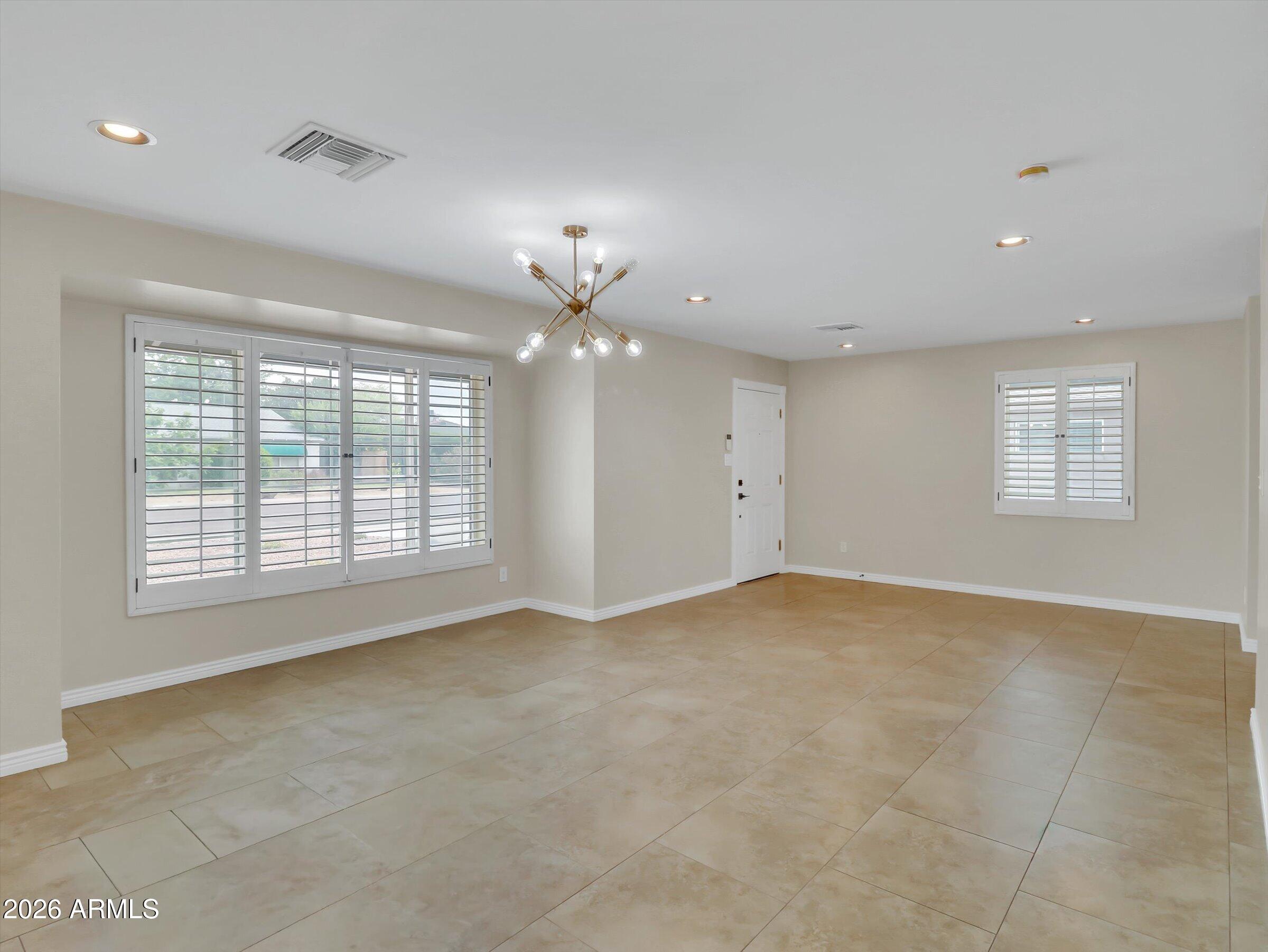 6036 North 8th Street Phoenix, AZ 85014 - Photo 5 of 31 a view of an empty room with a window