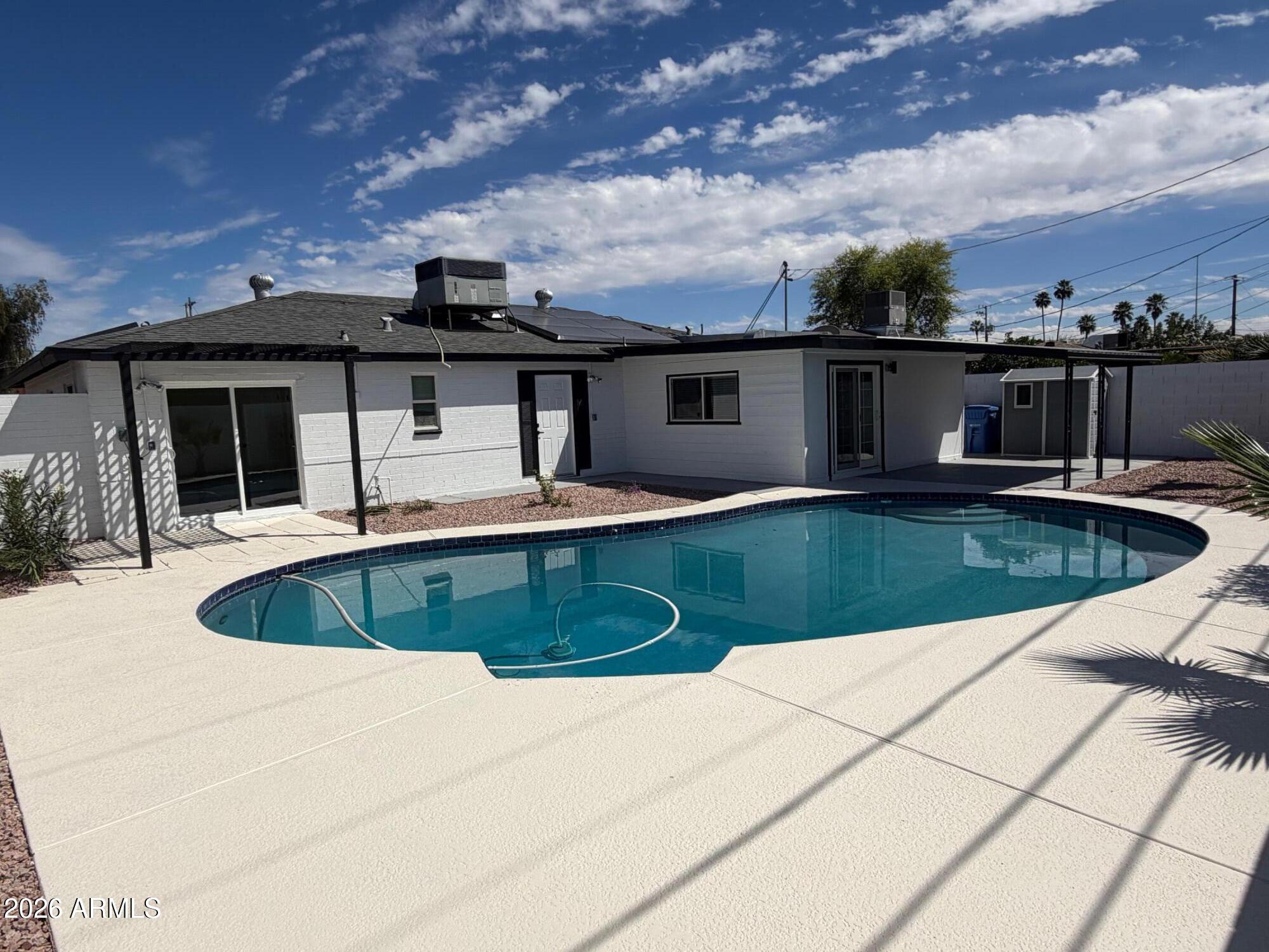 6036 North 8th Street Phoenix, AZ 85014 - Photo 5 of 37 a view of a swimming pool with a patio
