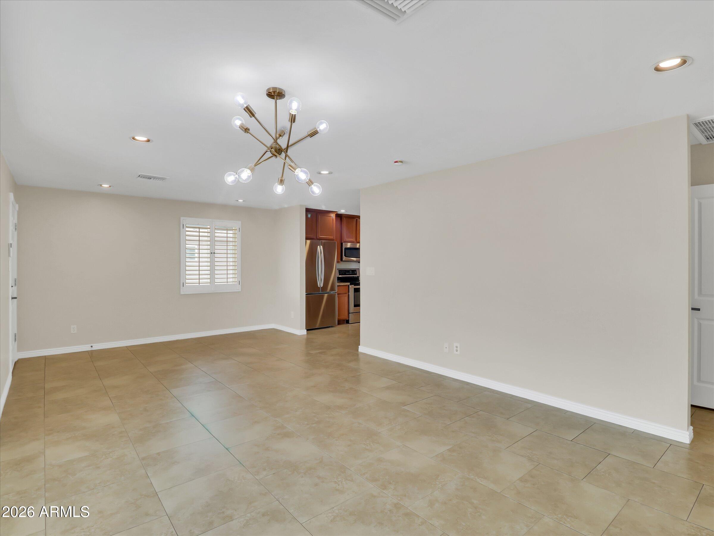 6036 North 8th Street Phoenix, AZ 85014 - Photo 6 of 31 a view of an empty room with a window