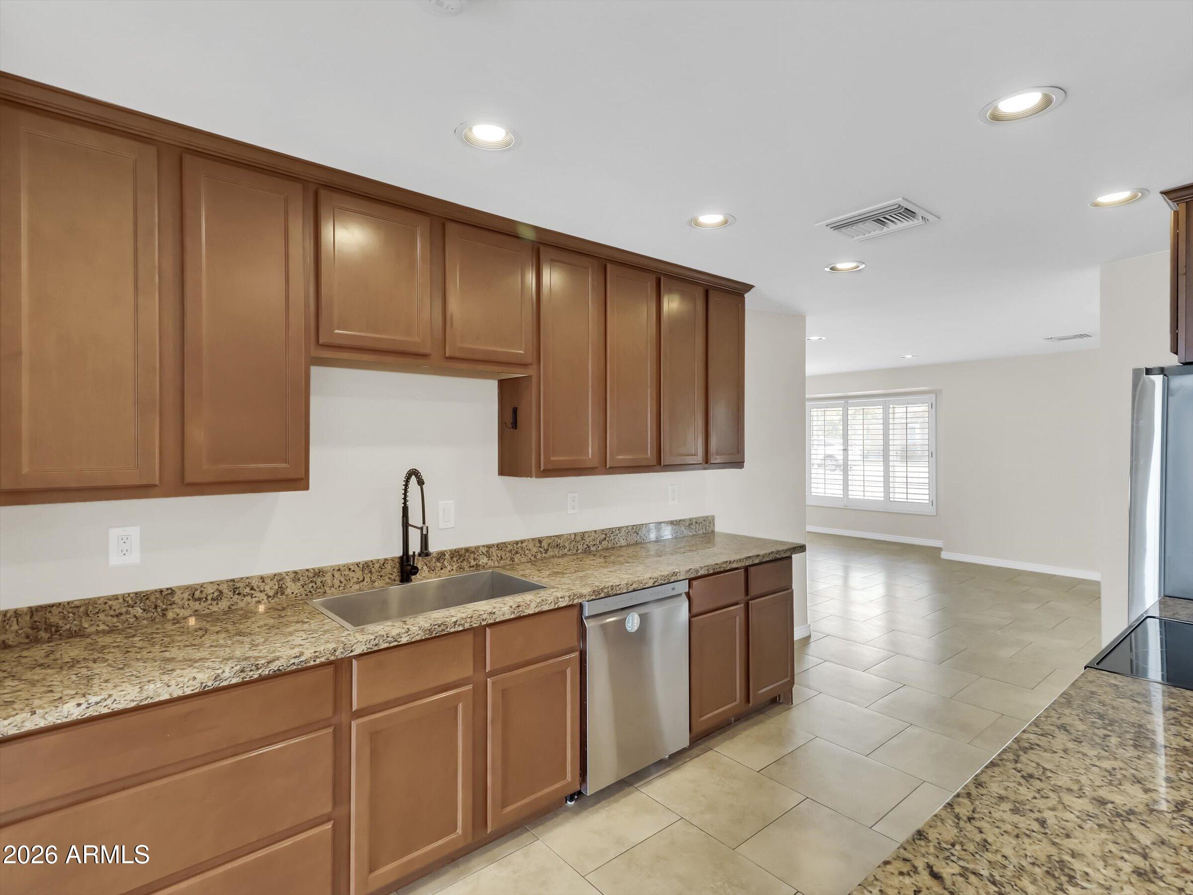 6036 North 8th Street Phoenix, AZ 85014 - Photo 9 of 31 a kitchen with a sink and cabinets