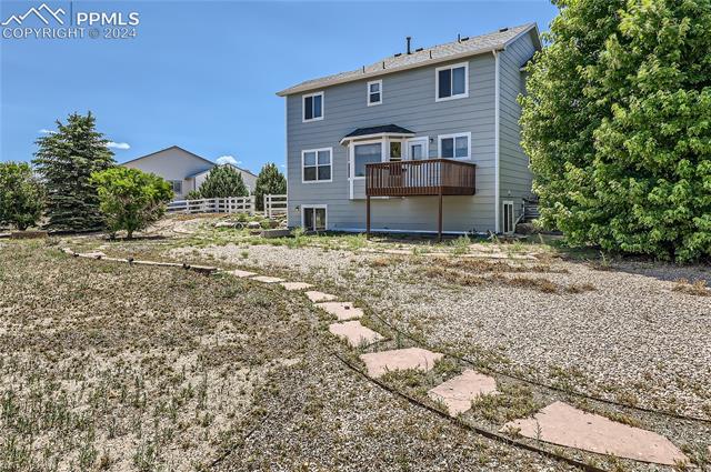 12510 Motley Road Peyton, CO 80831 - Photo 27 of 36 Back of house featuring a deck