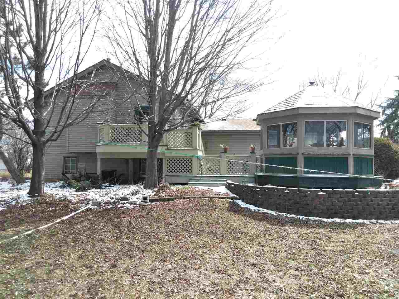 1039 South Trainer Road Rockford, IL 61108 - Photo 17 of 18 a front view of a house with yard covered in snow