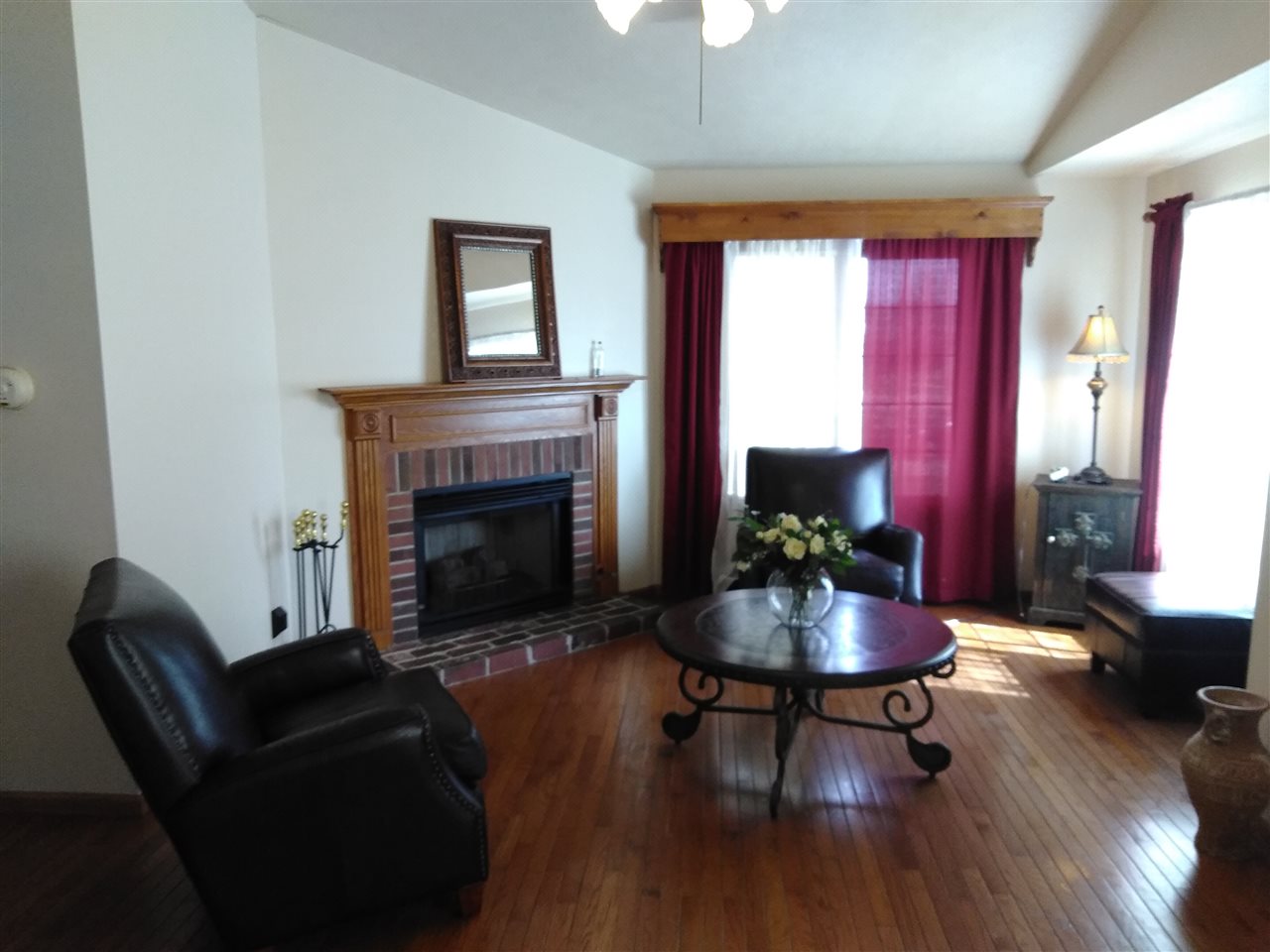 1039 South Trainer Road Rockford, IL 61108 - Photo 6 of 18 a living room with furniture and a fireplace