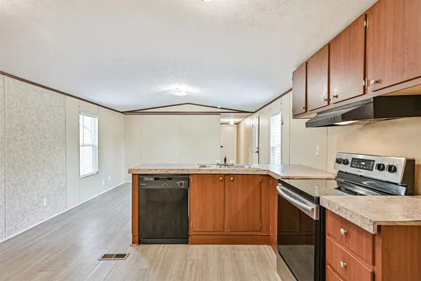a view of a hardwood floor in a room