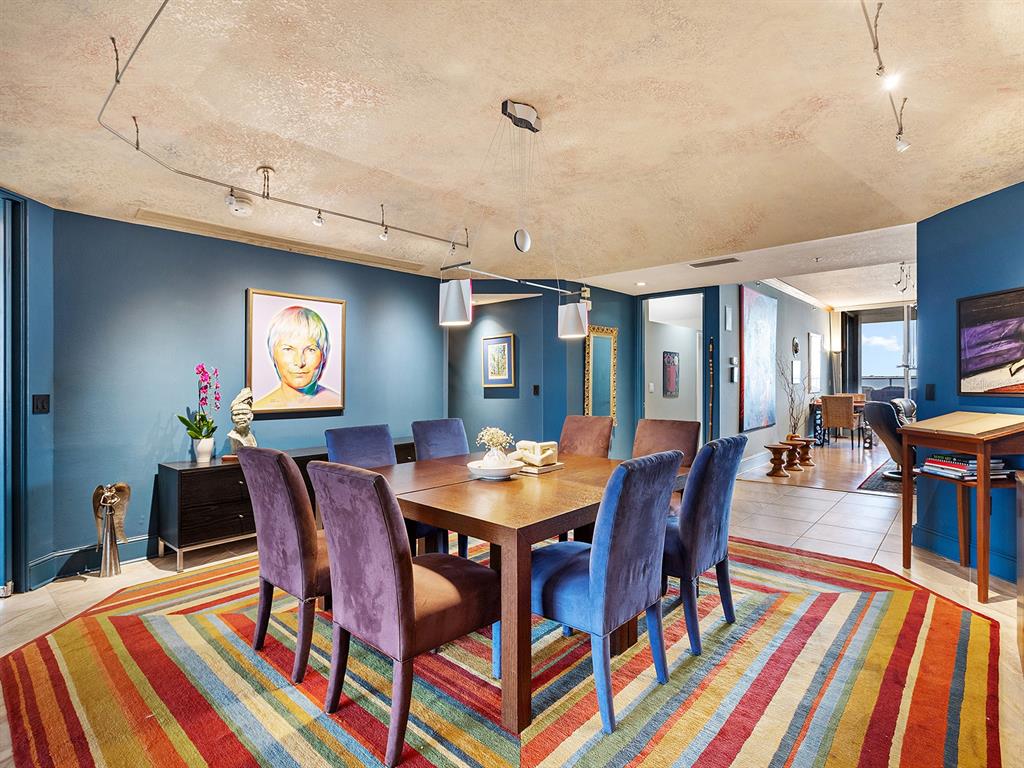 3040 Grand Bay Boulevard, Unit 213 Longboat Key, FL 34228 - Photo 13 of 44 a view of a dining room with furniture and wooden floor