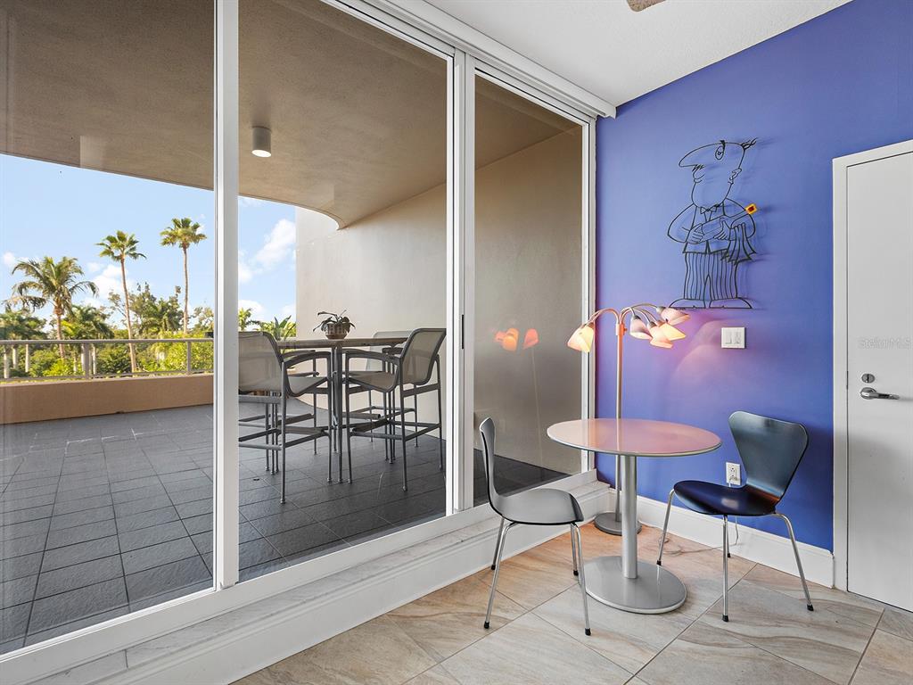 3040 Grand Bay Boulevard, Unit 213 Longboat Key, FL 34228 - Photo 16 of 44 a view of a dining room with furniture