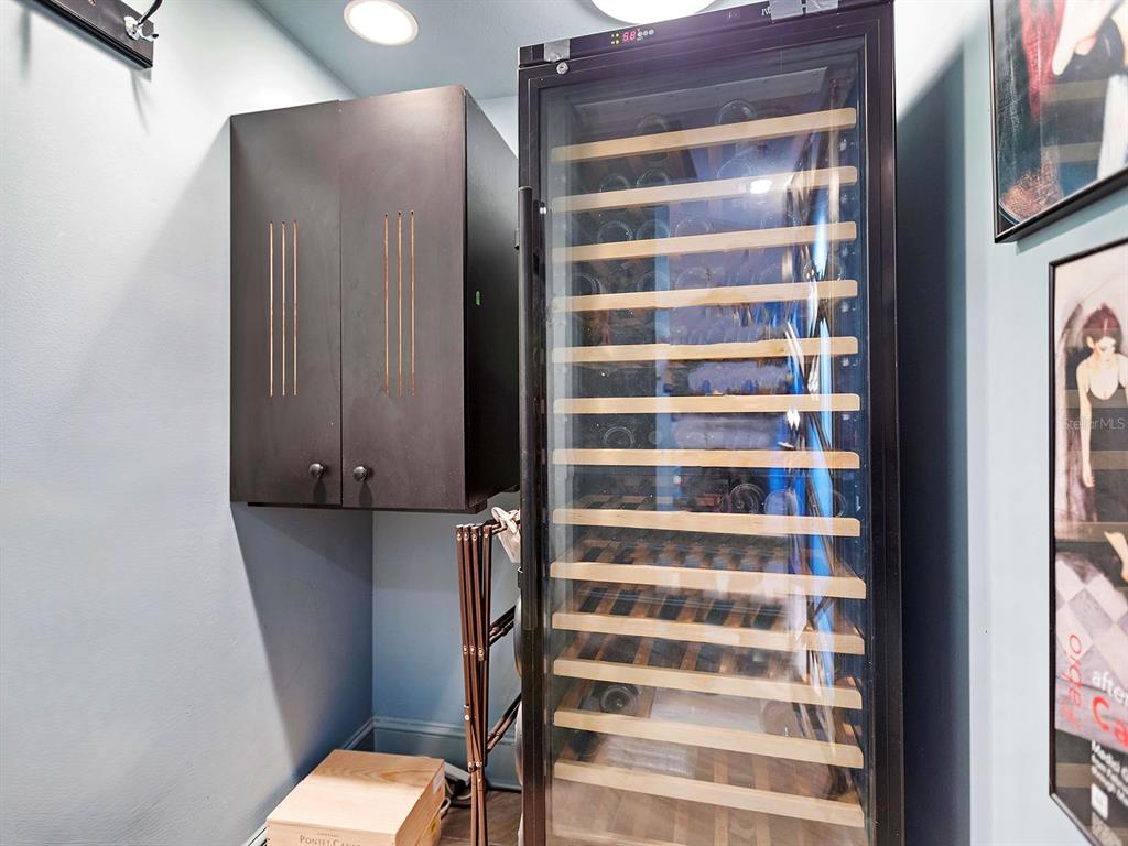 3040 Grand Bay Boulevard, Unit 213 Longboat Key, FL 34228 - Photo 31 of 44 a view of bathroom with a sink and a mirror