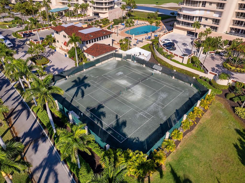 3040 Grand Bay Boulevard, Unit 213 Longboat Key, FL 34228 - Photo 37 of 44 an aerial view of residential houses with outdoor space