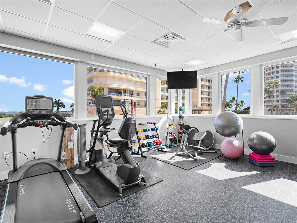 3040 Grand Bay Boulevard, Unit 213 Longboat Key, FL 34228 - Photo 40 of 44 a room with gym equipment and windows