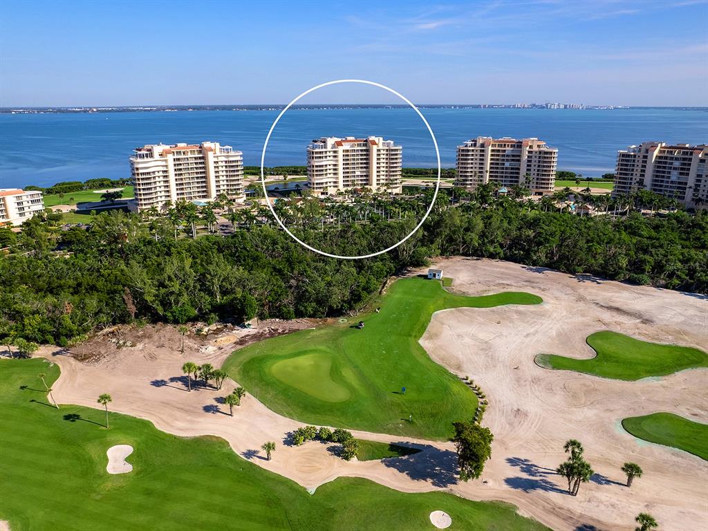 3040 Grand Bay Boulevard, Unit 213 Longboat Key, FL 34228 - Photo 44 of 44 an aerial view of a house