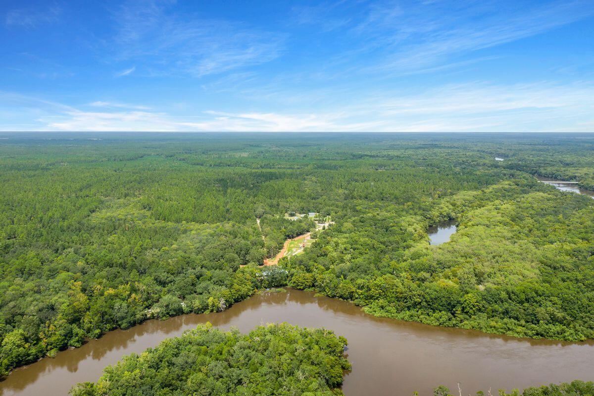 66 Sawmill Road Ponce de Leon, FL 32455 - Photo 3 of 14 a view of a lake with a city