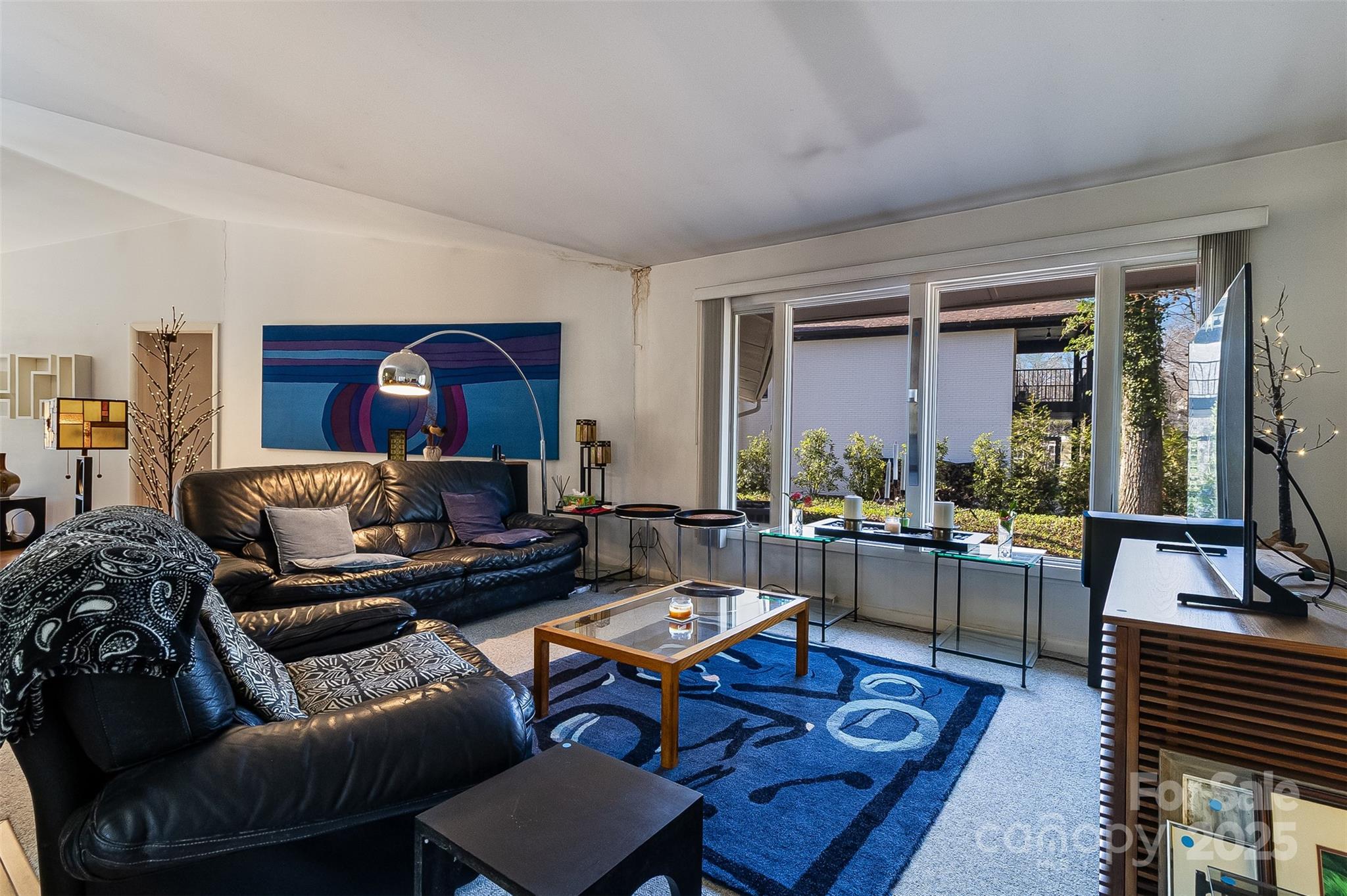 616 Robmont Road Charlotte, NC 28270 - Photo 11 of 38 a living room with furniture and a large window
