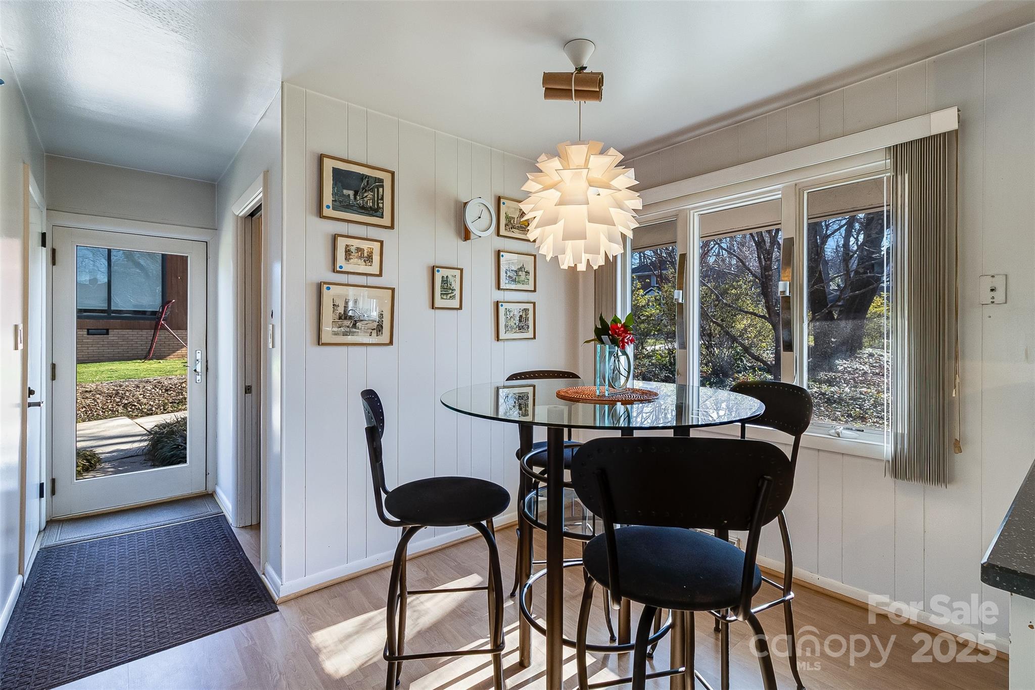 616 Robmont Road Charlotte, NC 28270 - Photo 16 of 38 a view of a dining room with furniture wooden floor and chandelier