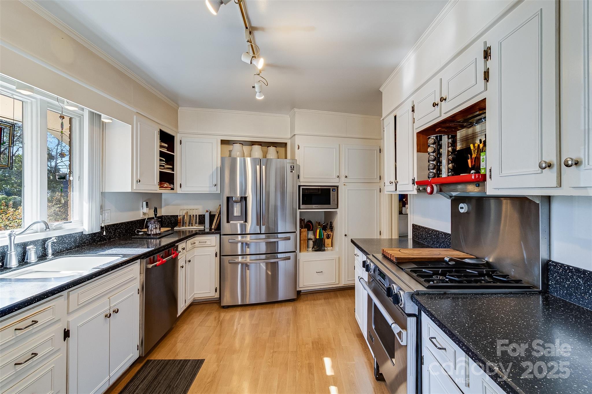 616 Robmont Road Charlotte, NC 28270 - Photo 17 of 38 a kitchen with stainless steel appliances granite countertop a stove refrigerator sink and microwave