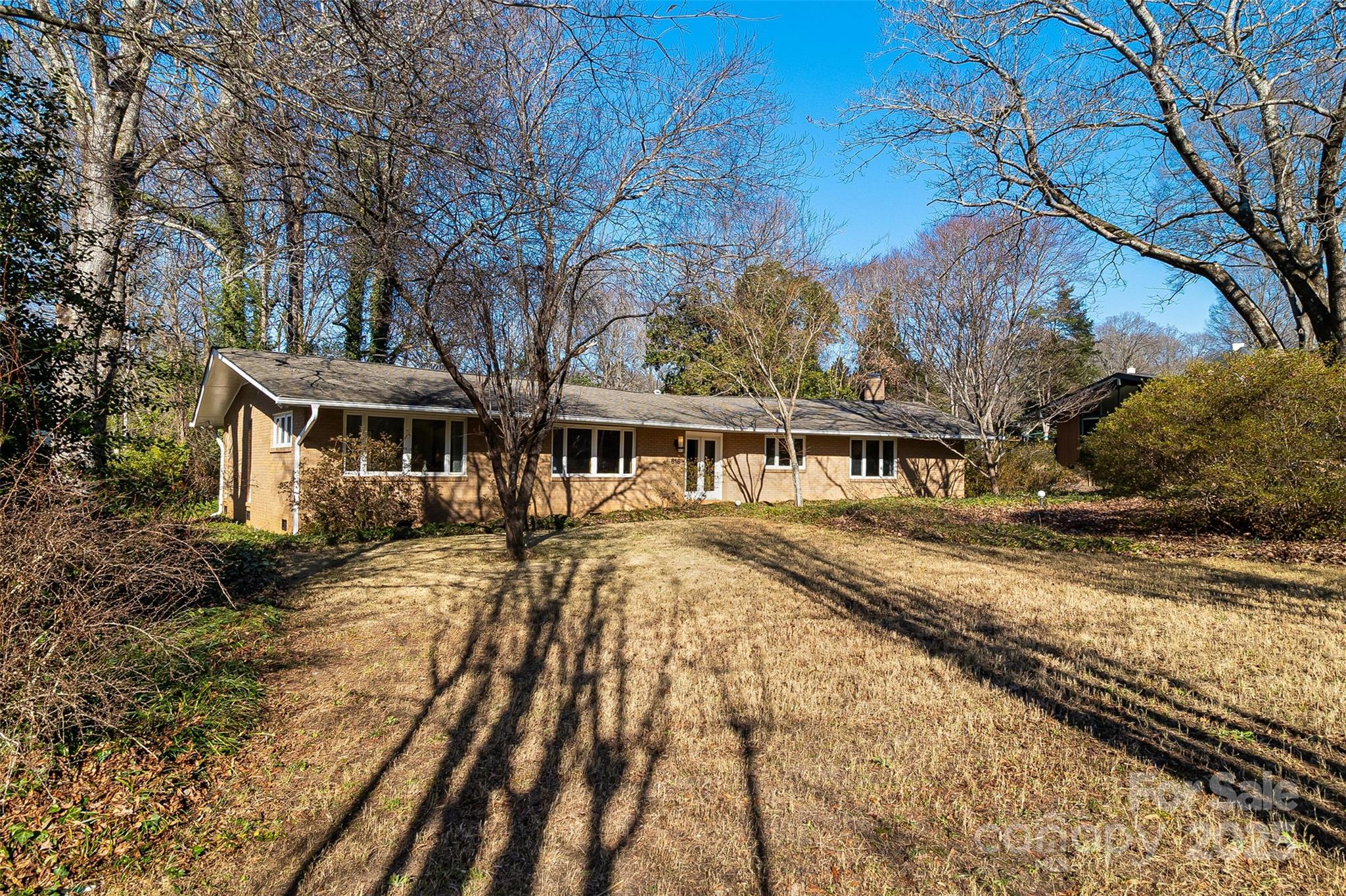 616 Robmont Road Charlotte, NC 28270 - Photo 2 of 38 a view of a house with a yard covered with snow in the background