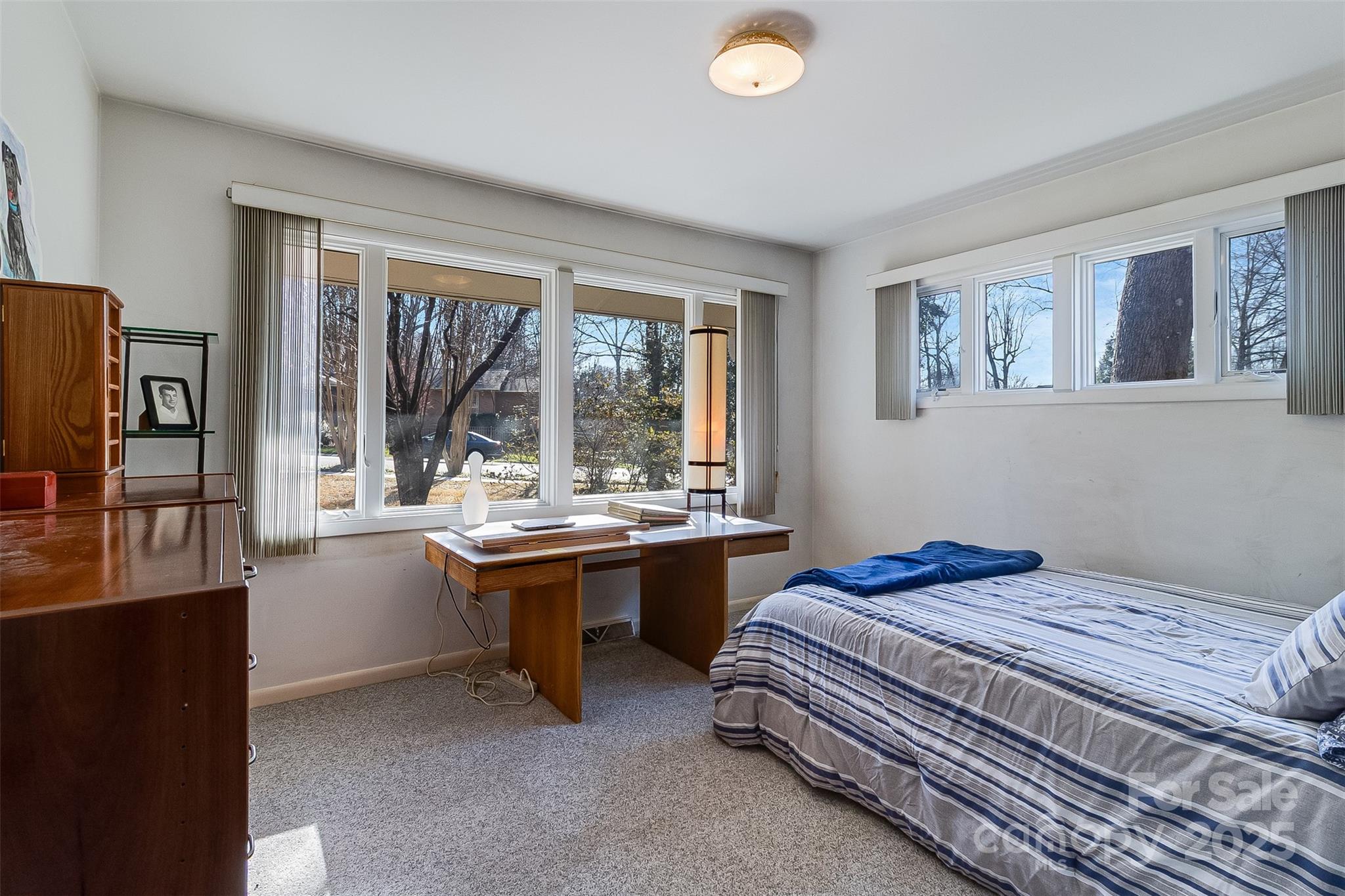 616 Robmont Road Charlotte, NC 28270 - Photo 29 of 38 a bed room with a bed and a desk