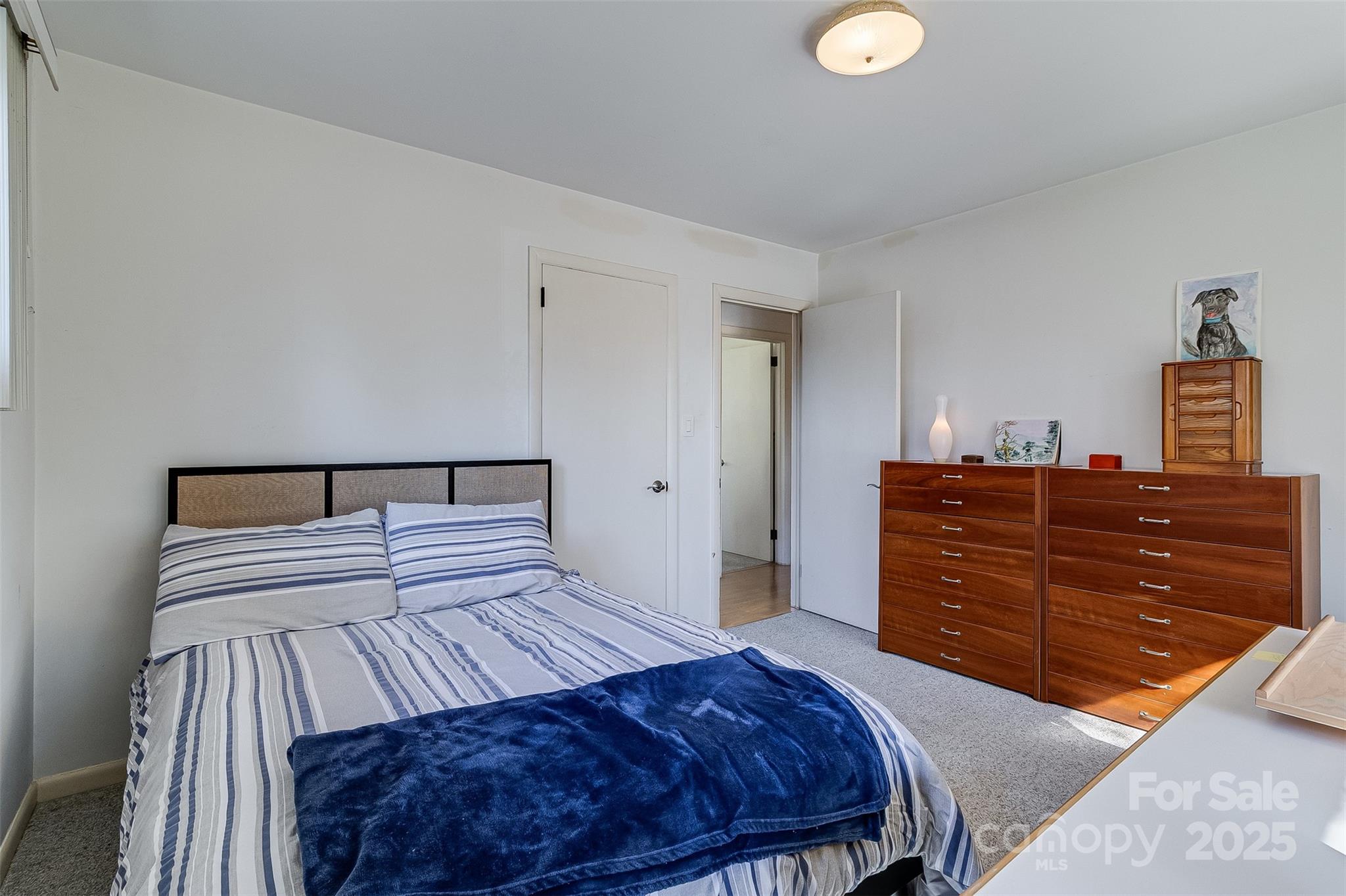 616 Robmont Road Charlotte, NC 28270 - Photo 30 of 38 a bedroom with a bed and cabinet