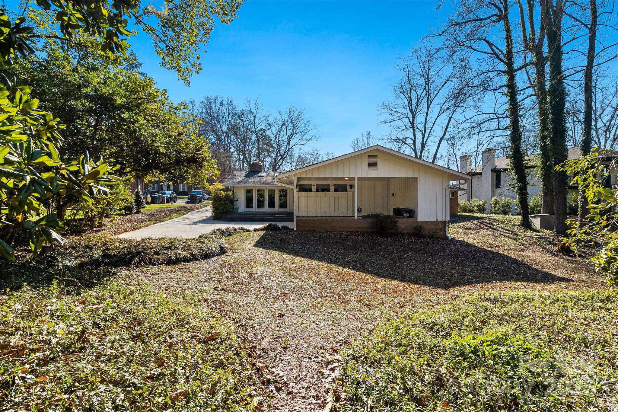 616 Robmont Road Charlotte, NC 28270 - Photo 36 of 38 a front view of a house with a yard and large tree