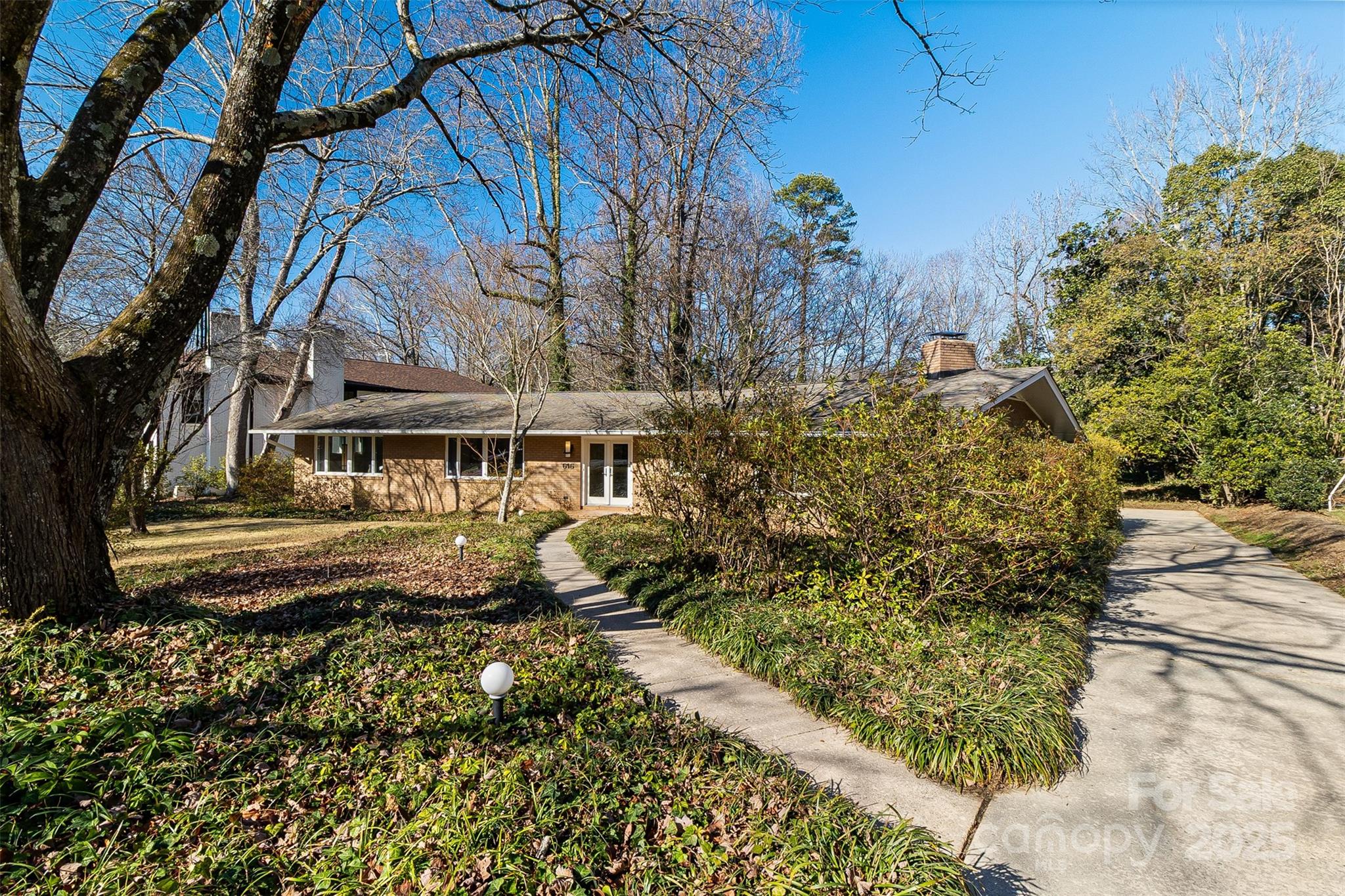 616 Robmont Road Charlotte, NC 28270 - Photo 4 of 38 a front view of a house with a yard