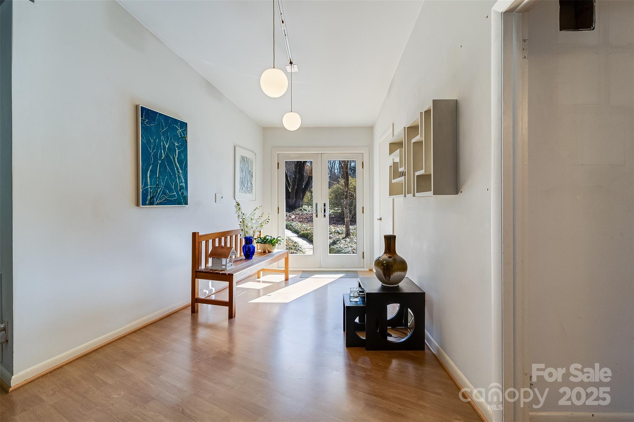 616 Robmont Road Charlotte, NC 28270 - Photo 6 of 38 a living room with furniture and a wooden floor