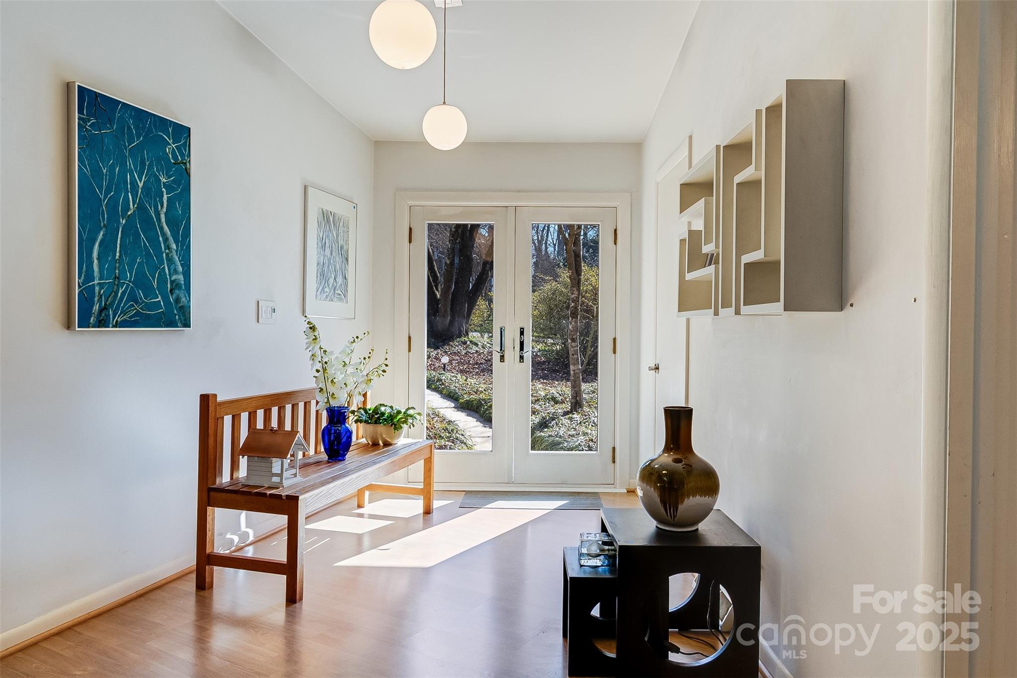 616 Robmont Road Charlotte, NC 28270 - Photo 7 of 38 a living room with furniture and a book shelf