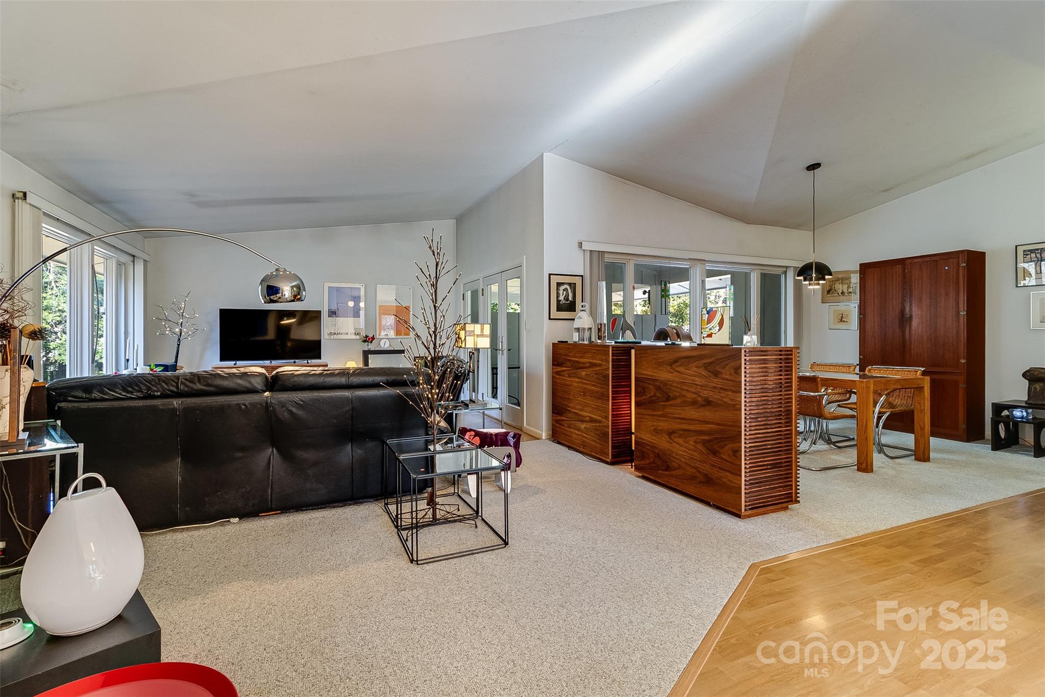 616 Robmont Road Charlotte, NC 28270 - Photo 9 of 38 a living room with furniture and a flat screen tv