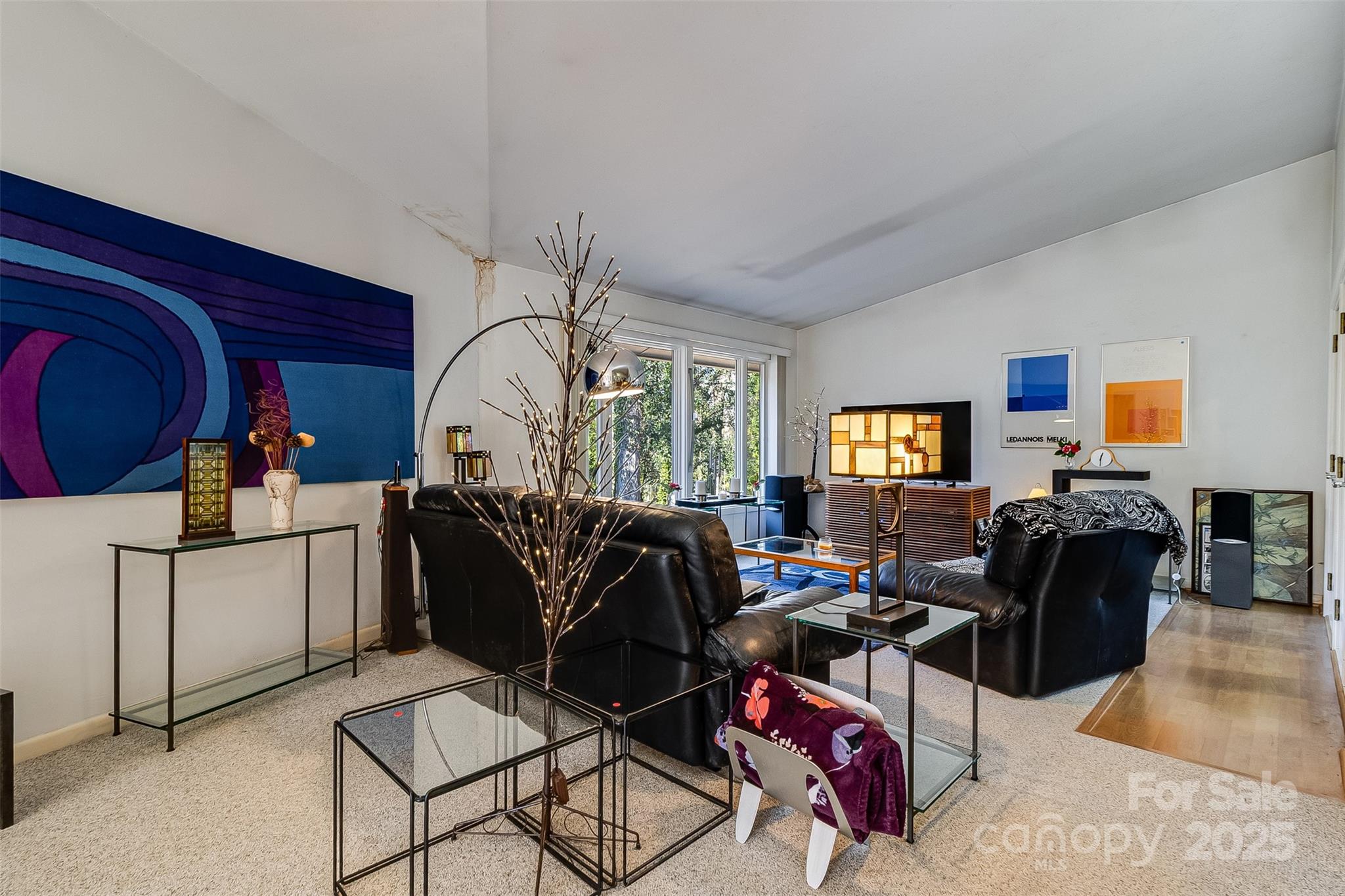 616 Robmont Road Charlotte, NC 28270 - Photo 10 of 38 a living room with furniture a flat screen tv and a window